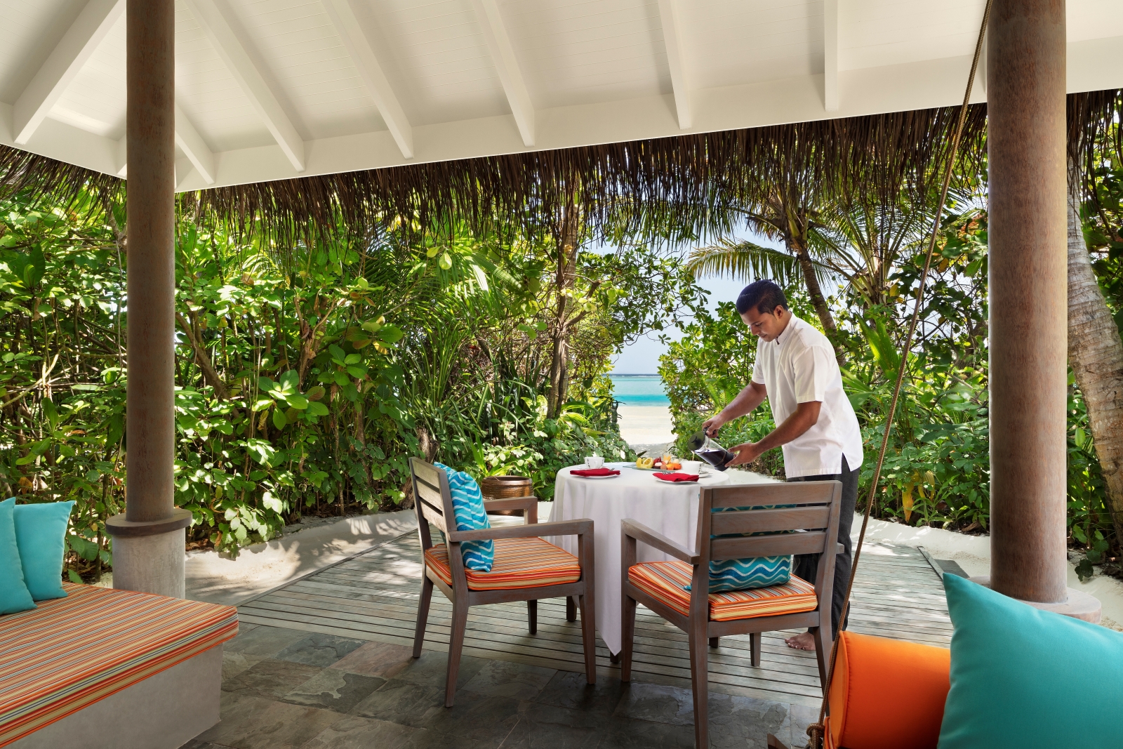 Private breakfast setup on the terrace of a Sunrise Beach Villa at luxury resort Anantara Dhigu in the Maldives
