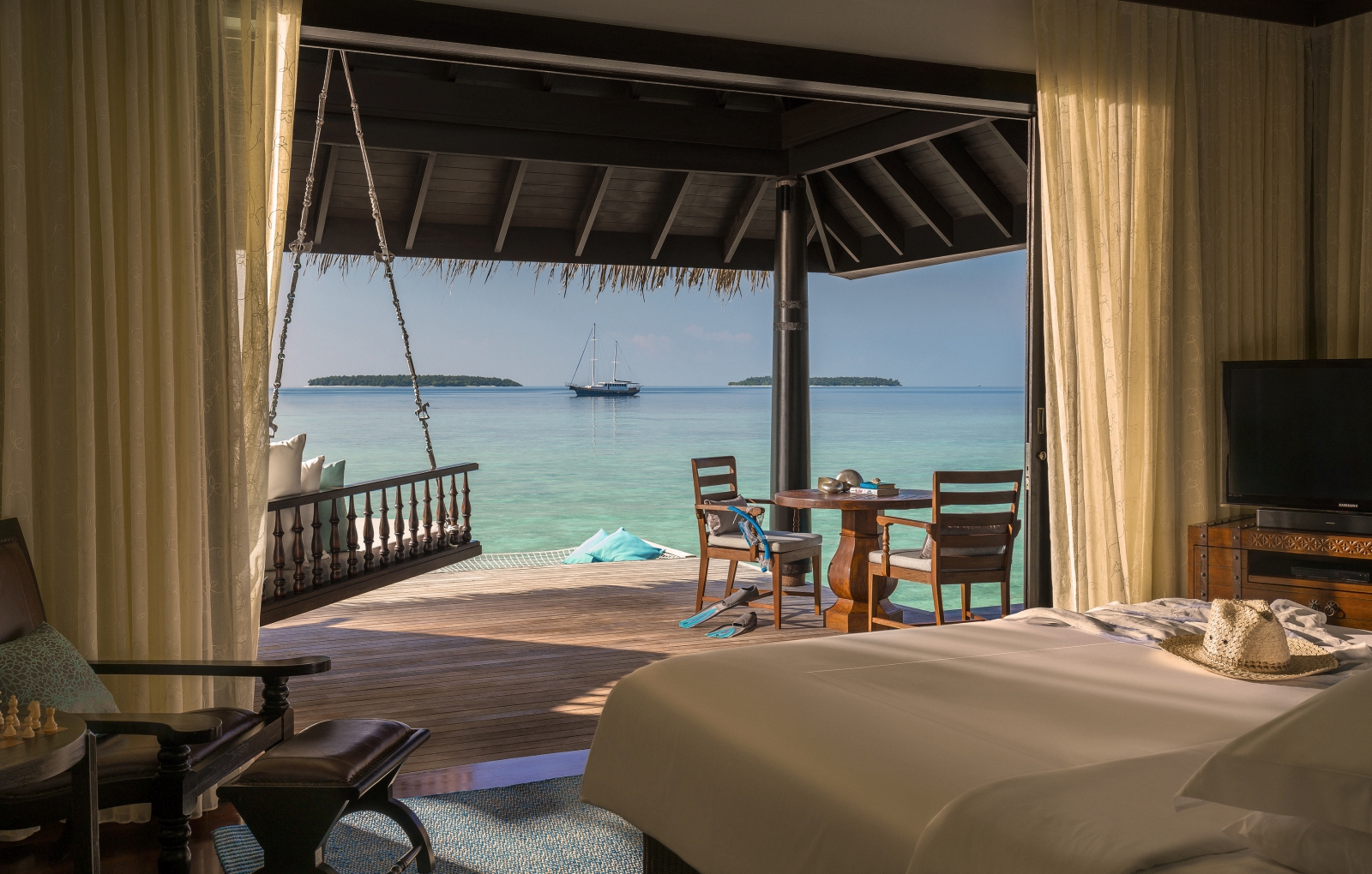 Overwater Villa with private deck at luxury resort Anantara Kihavah in the Maldives
