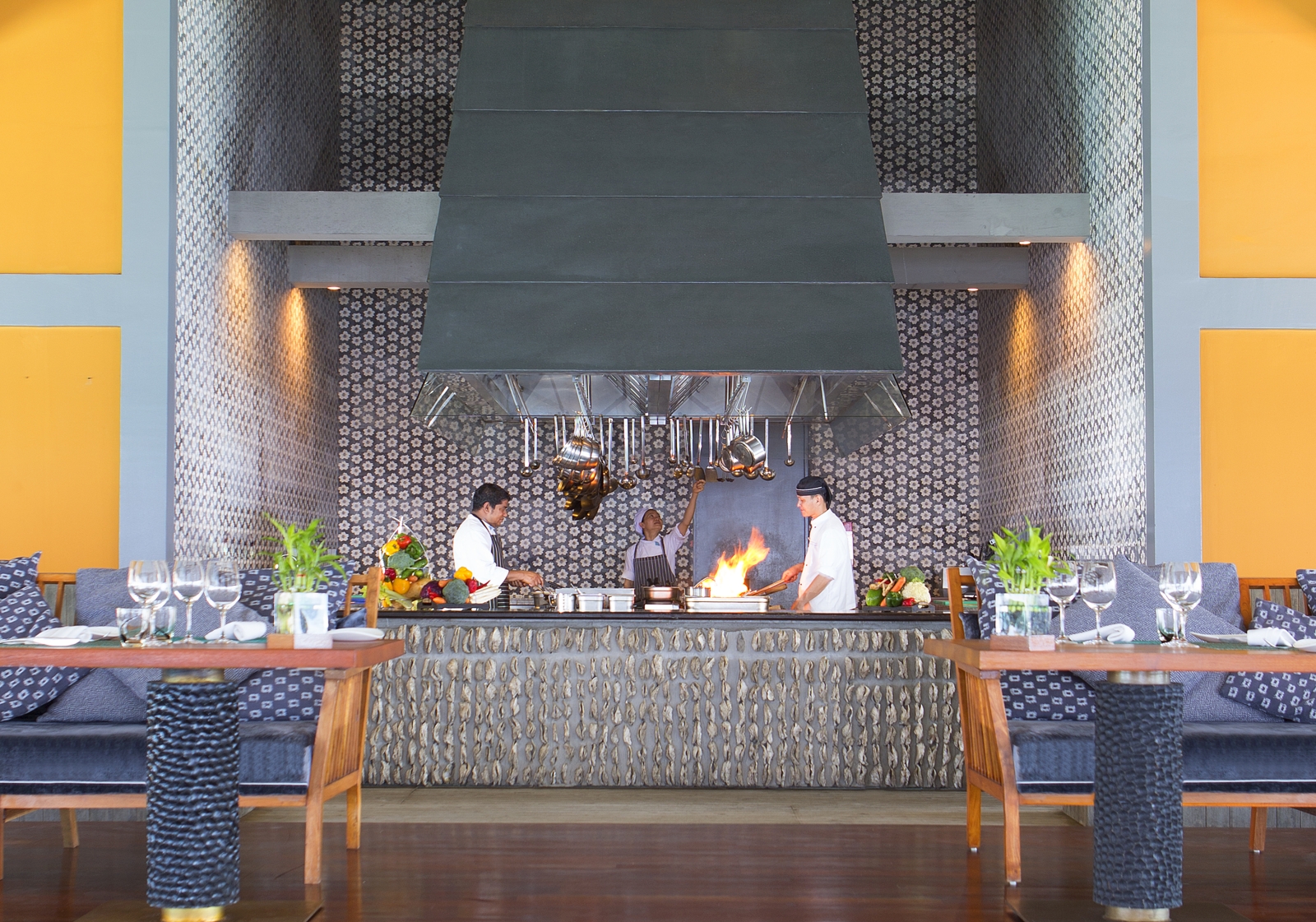 Chefs working in the open kitchen of Salt restaurant at luxury resort Anantara Kihavah in the Maldives