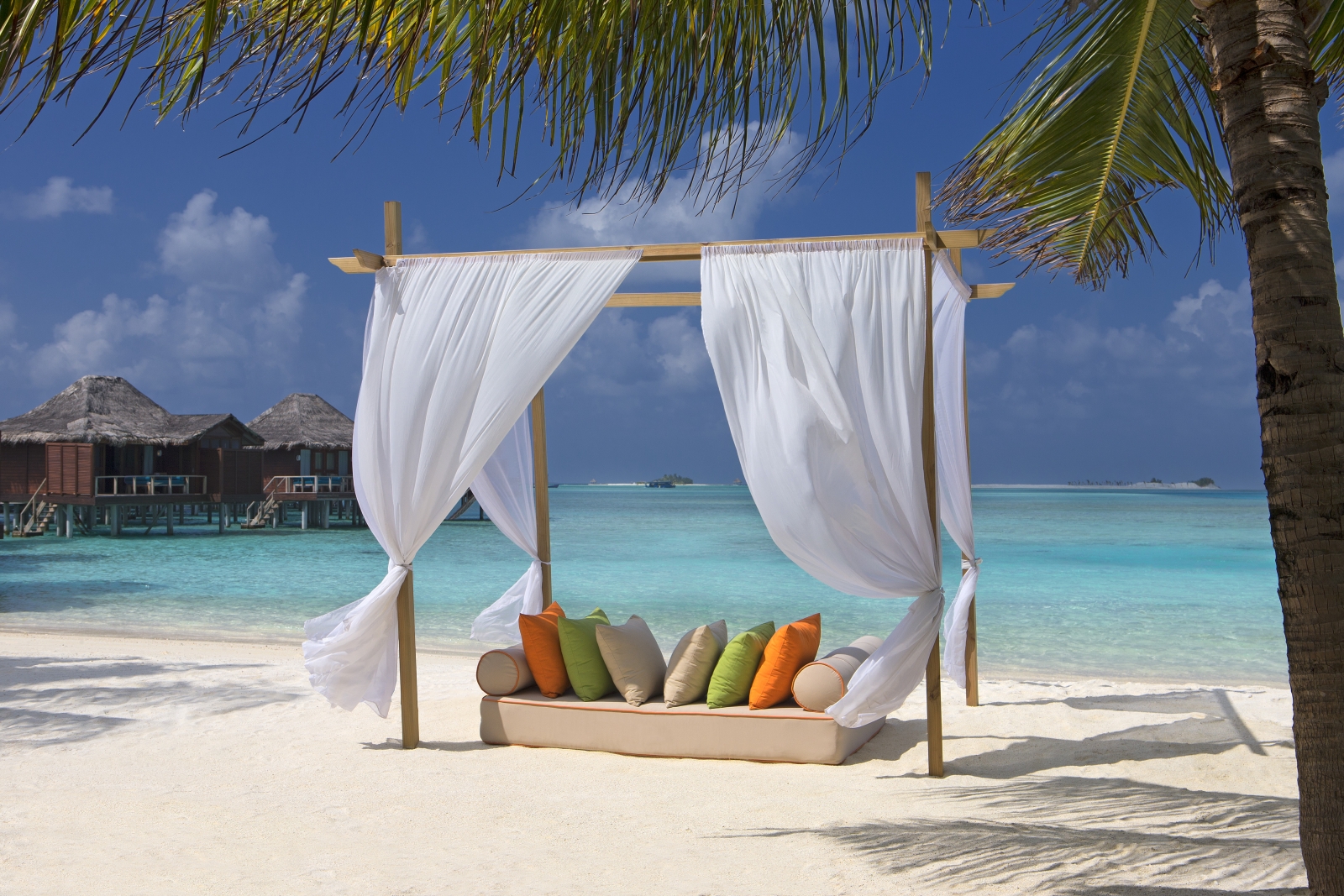 Beach cabana on the white sand beach of luxury resort Anantara Veli in the Maldives