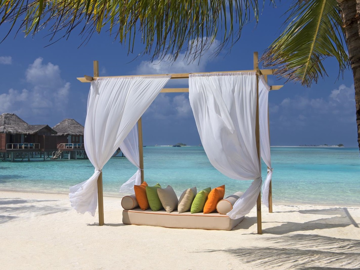 Beach cabana on the white sand beach of luxury resort Anantara Veli in the Maldives