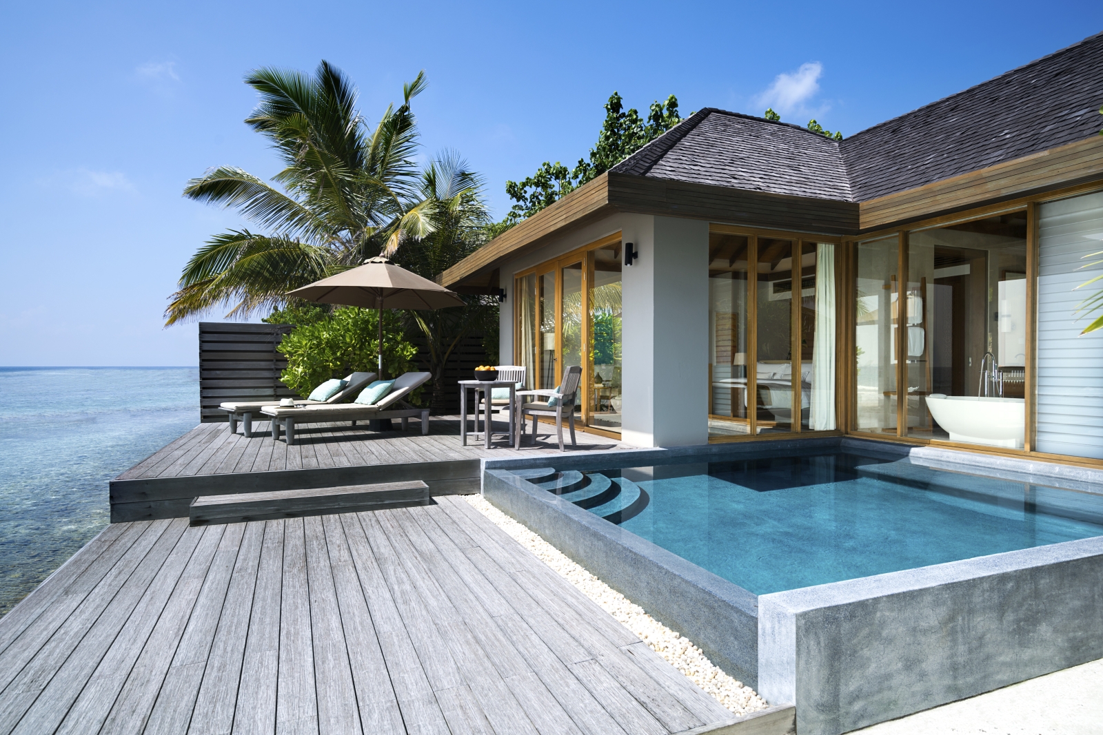 Private deck of an Ocean Pool Bungalow at luxury resort Anantara Veli in the Maldives
