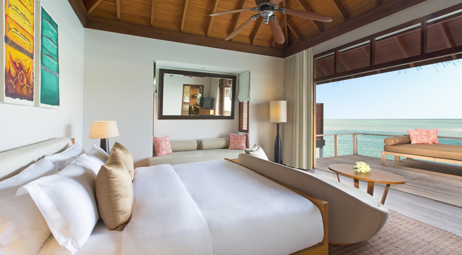 Bedroom of a Superior Overwater Bungalow at luxury resort Anantara Veli in the Maldives