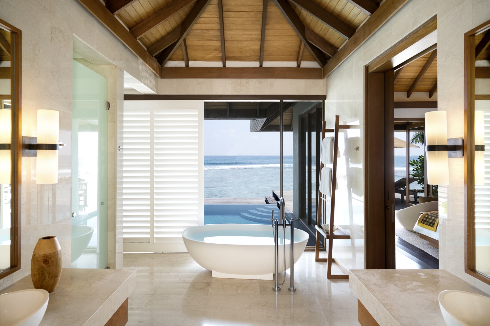 Bathroom of an Ocean Pool Bungalow with freestanding bathtub at luxury resort Anantara Veli in the Maldives
