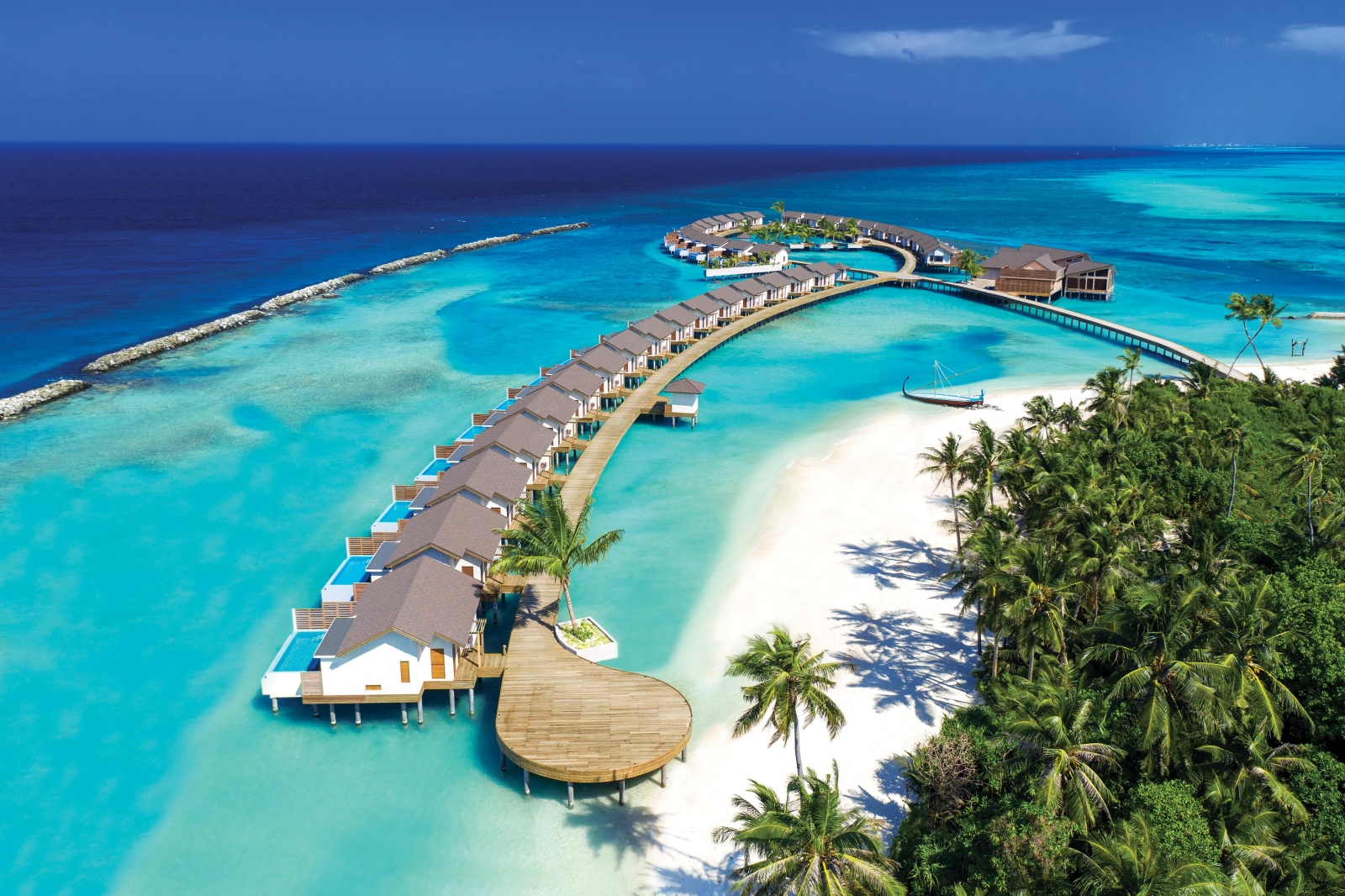 Aerial view of the jetty of Water Villas at luxury resort Atmosphere Kanifushi in the Maldives