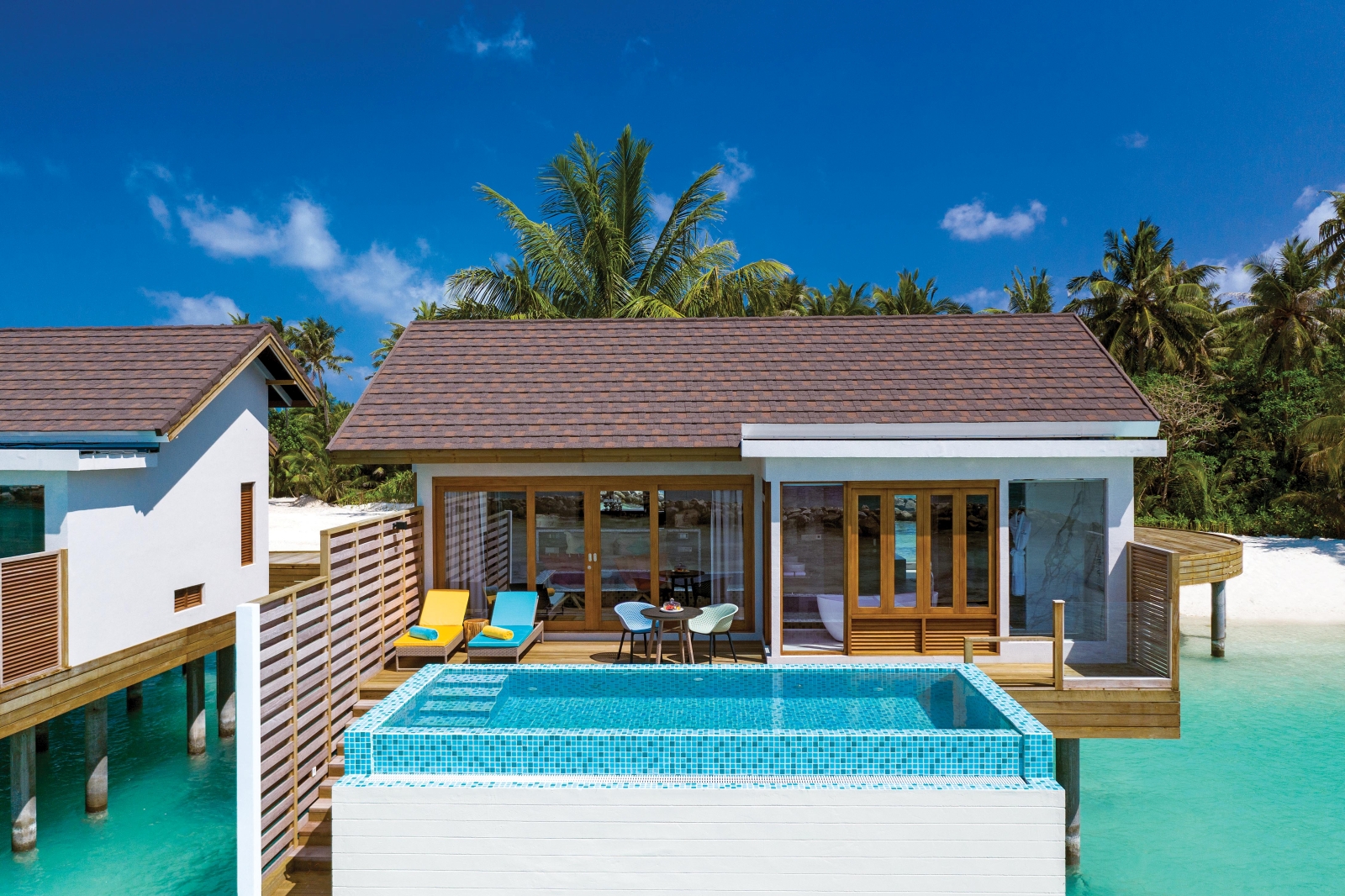 Exterior view of a Water Villa with Pool at luxury resort Atmosphere Kanifushi in the Maldives