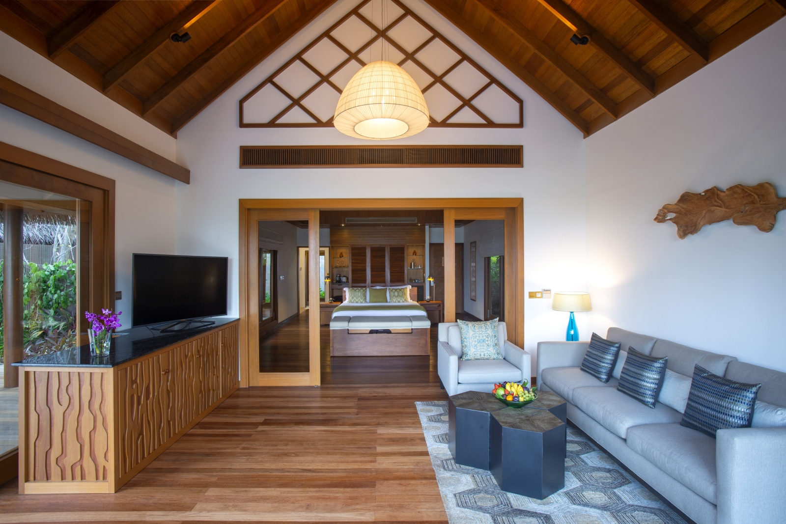 Living room and bedroom in Baros Suite at Baros