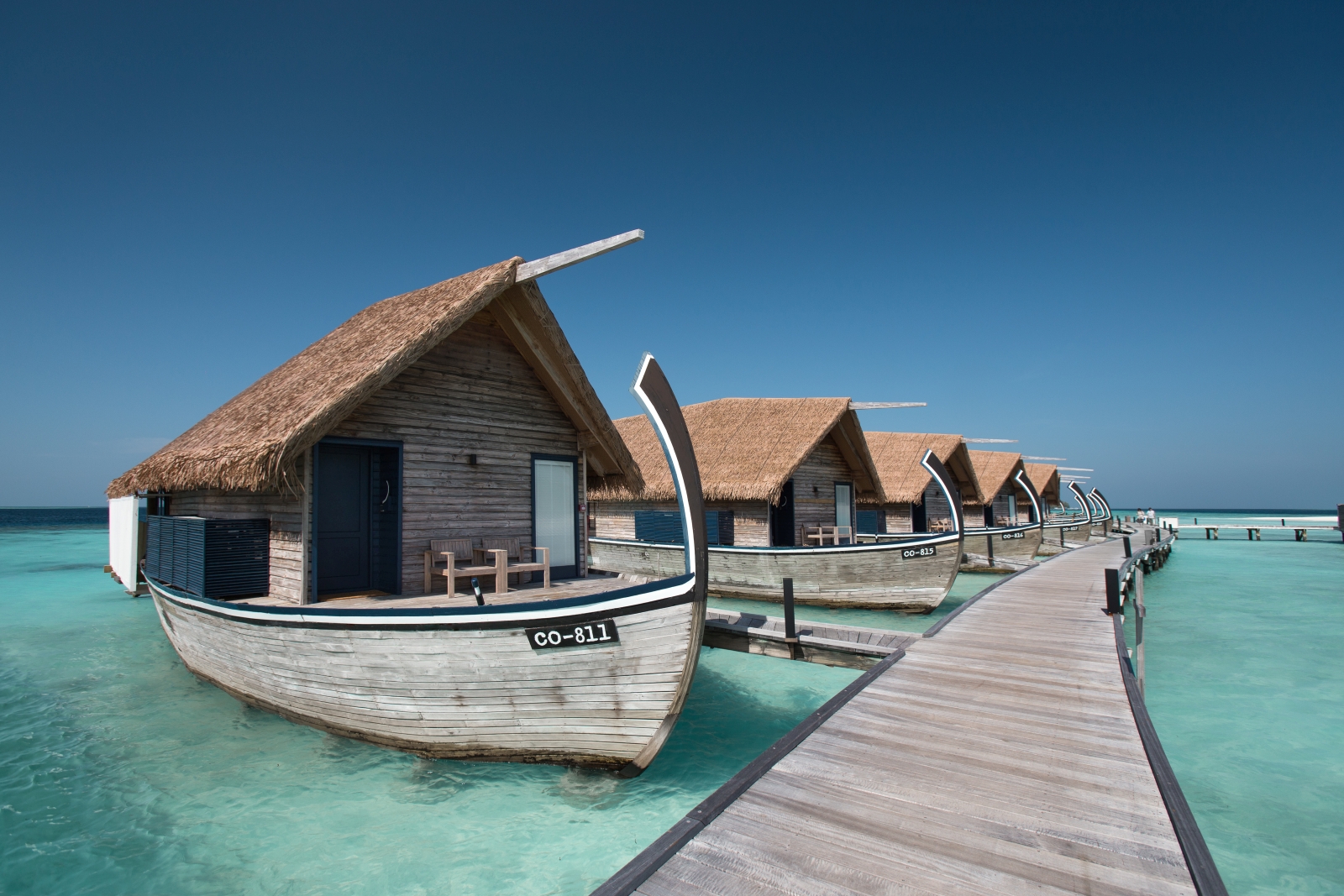Exterior view of the jetty with Dhoni Water Villas at luxury resort Cocoa Island in the Maldives