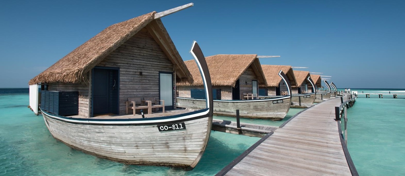 Exterior view of the jetty with Dhoni Water Villas at luxury resort Cocoa Island in the Maldives