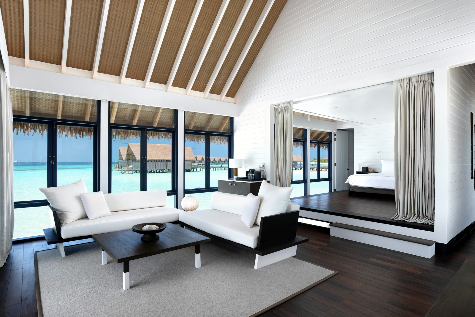 Living Room of a One-Bedroom Water Villa at luxury resort Cocoa Island in the Maldives