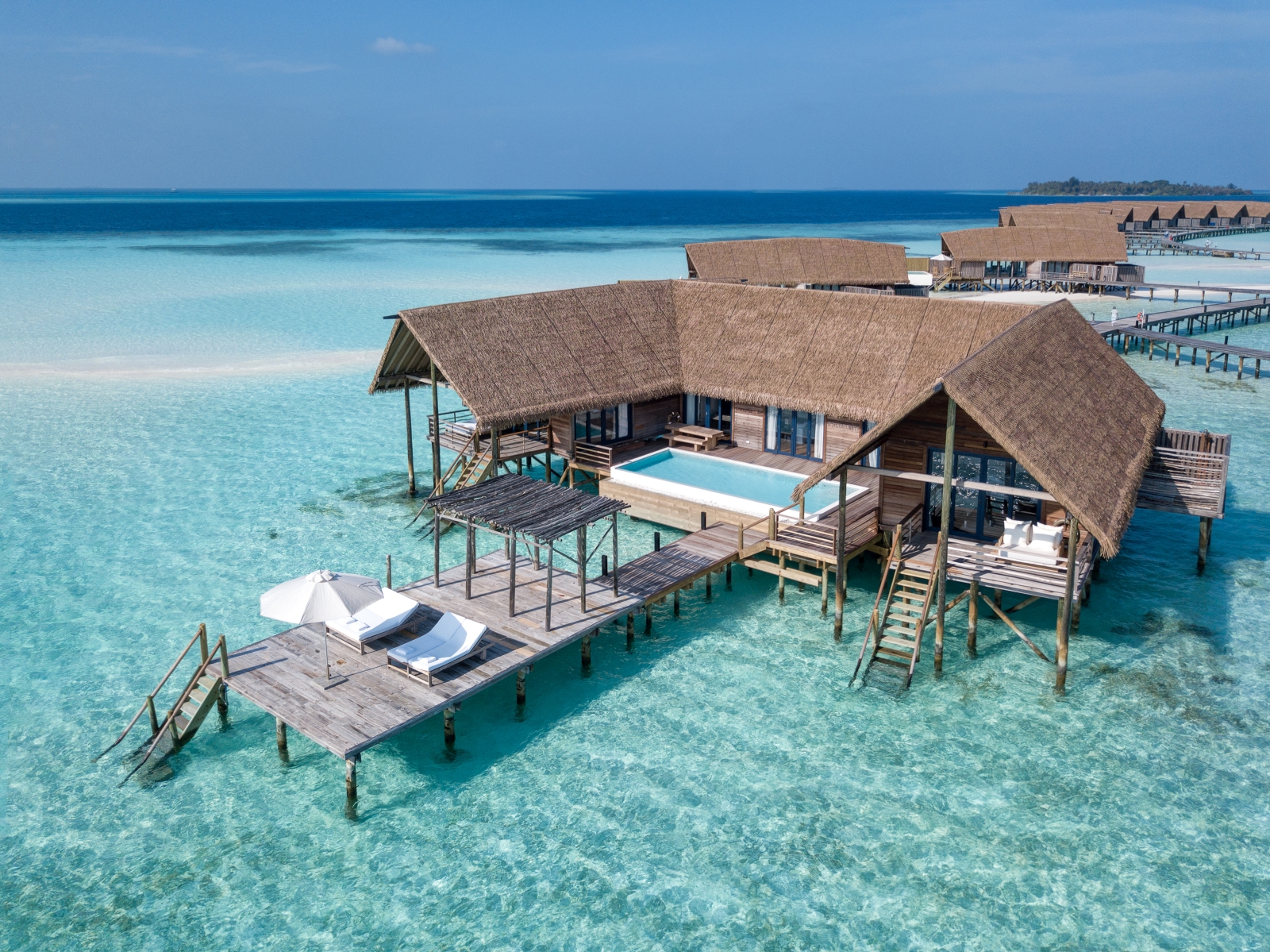 Aerial shot of a Water Villa with private pool at luxury resort Cocoa Island in the Maldives