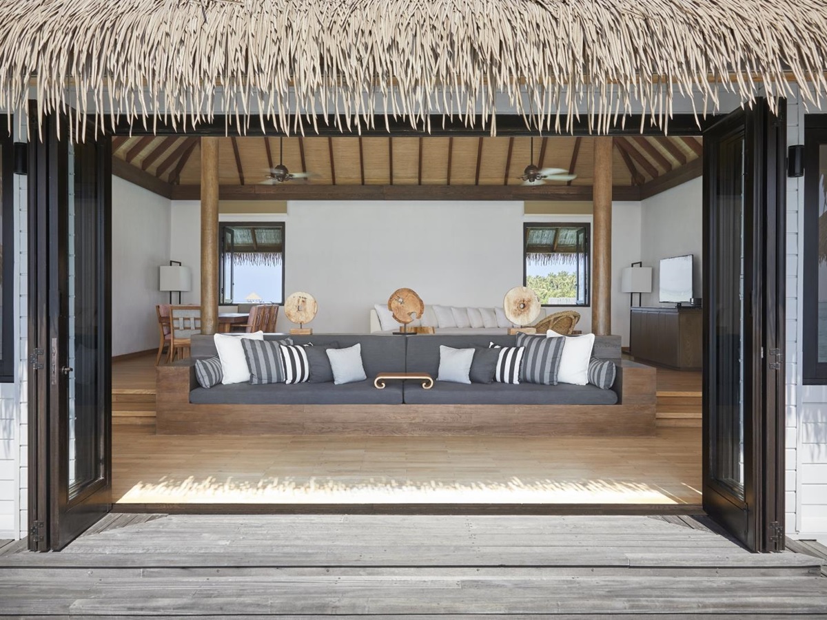 View into the lounge of a two-bedroom Water Villa at luxury resort COMO Maalifushi in the Maldives