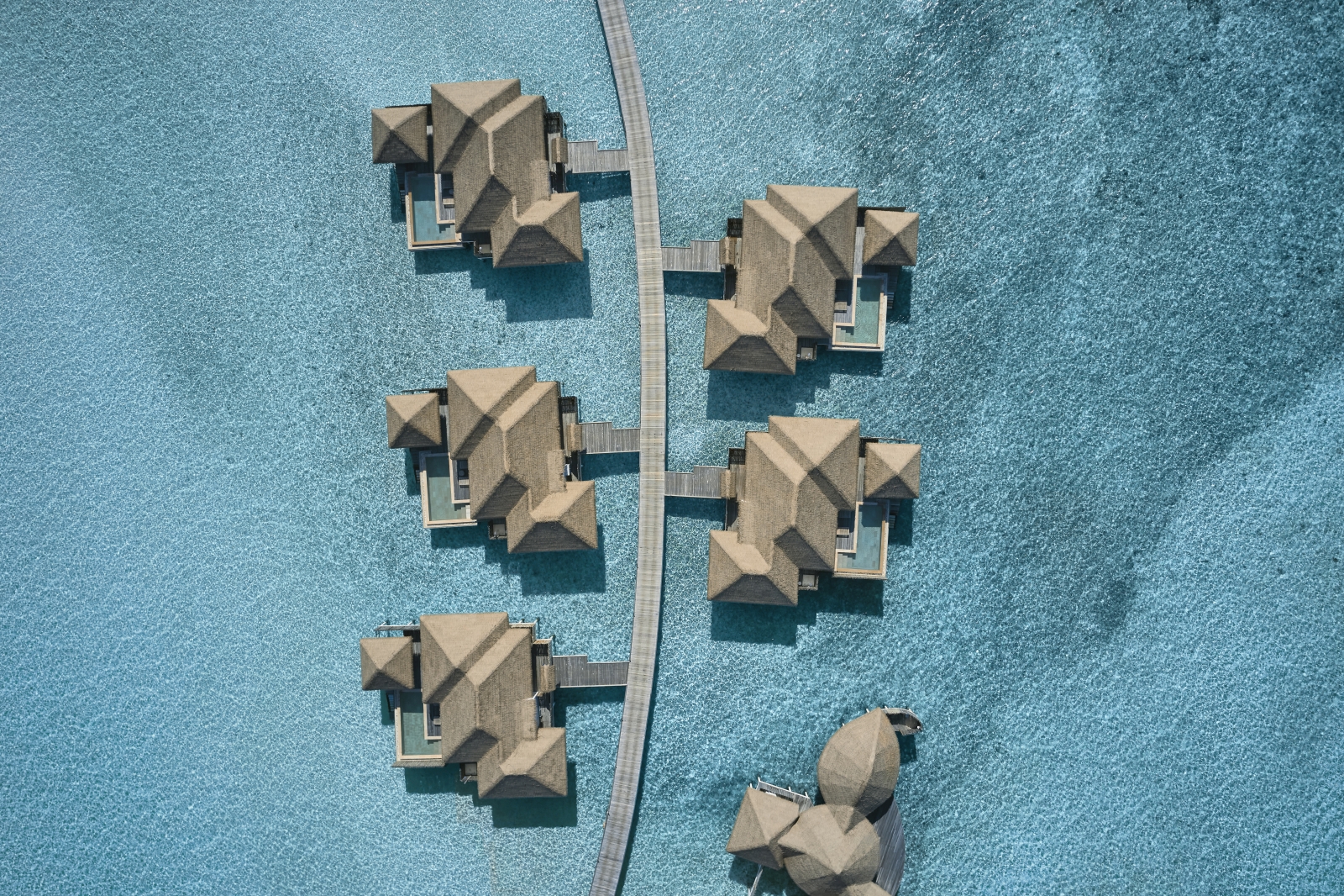 Aerial view of Water villa at luxury resort COMO Maalifushi in the Maldives