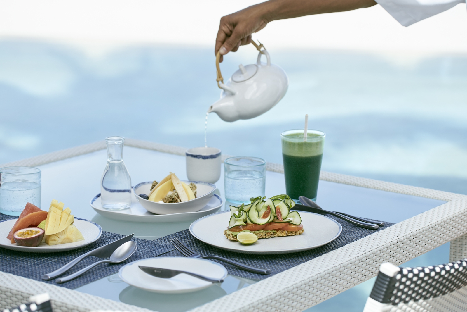 Breakfast by the pool at luxury resort COMO Maalifushi in the Maldives