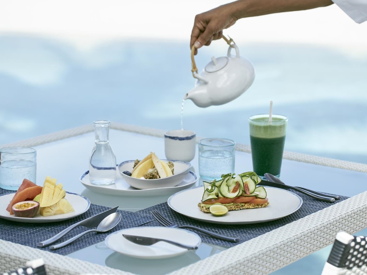 Breakfast by the pool at luxury resort COMO Maalifushi in the Maldives