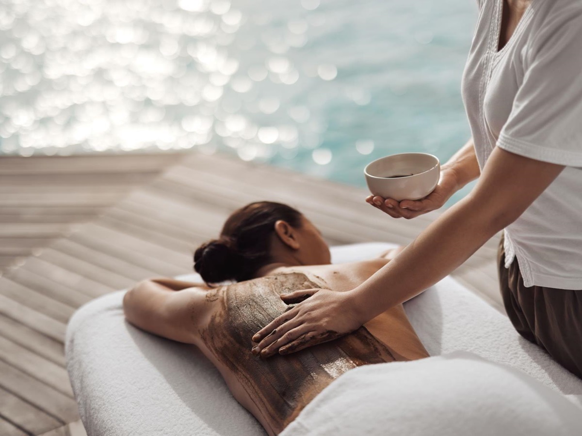 A guest receiving a body treatment at COMO Shambala wellness retreat at COMO Maalifushi in the Maldives