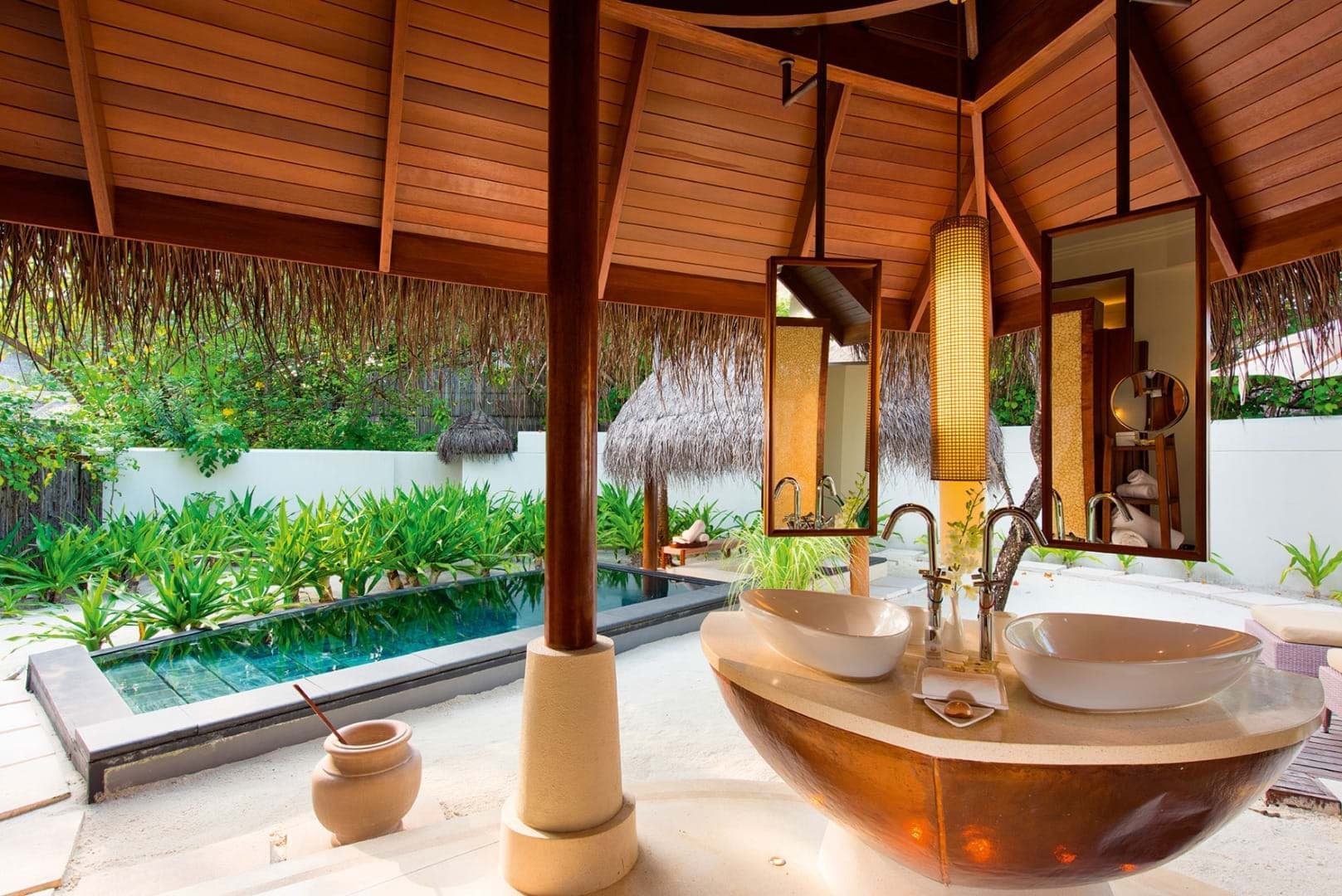 Outdoor bathroom of a beach villa at Constance Halaveli Maldives