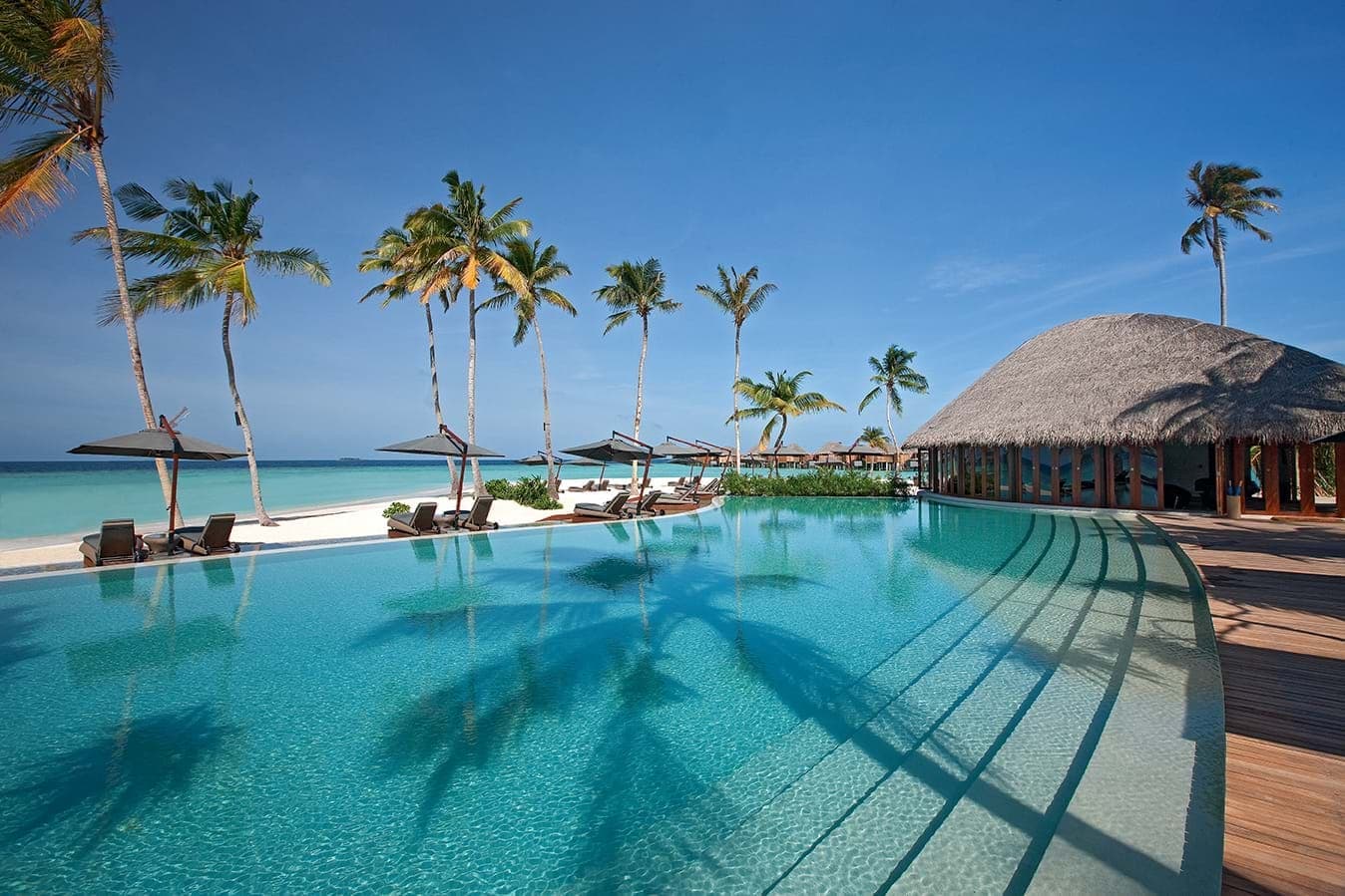 The swimming pool and beach at Constance Halaveli Maldives