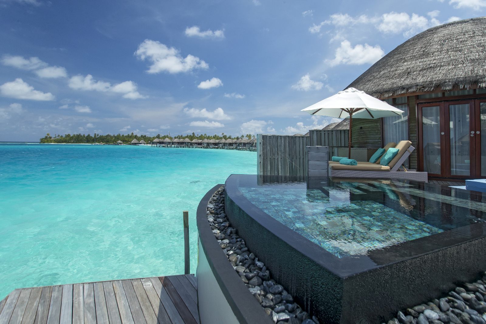 An overwater villa with plunge pool at Constance Halaveli Maldives