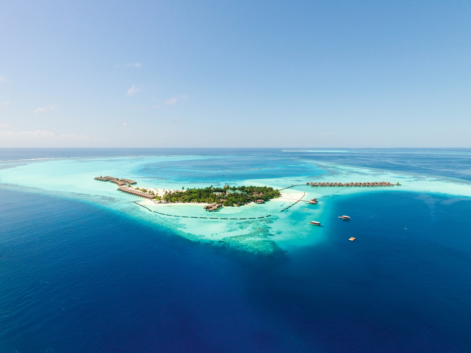 Aerial view of the island of luxury resort Constance Moofushi in the Maldives