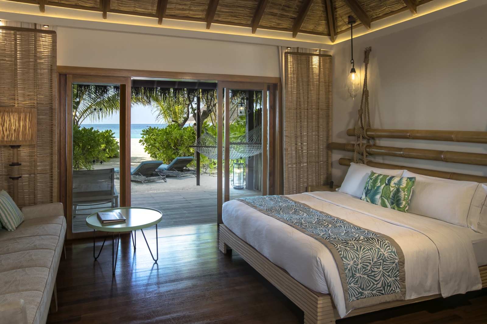 Bedroom of a beach villa at luxury resort Constance Moofushi in the Maldives