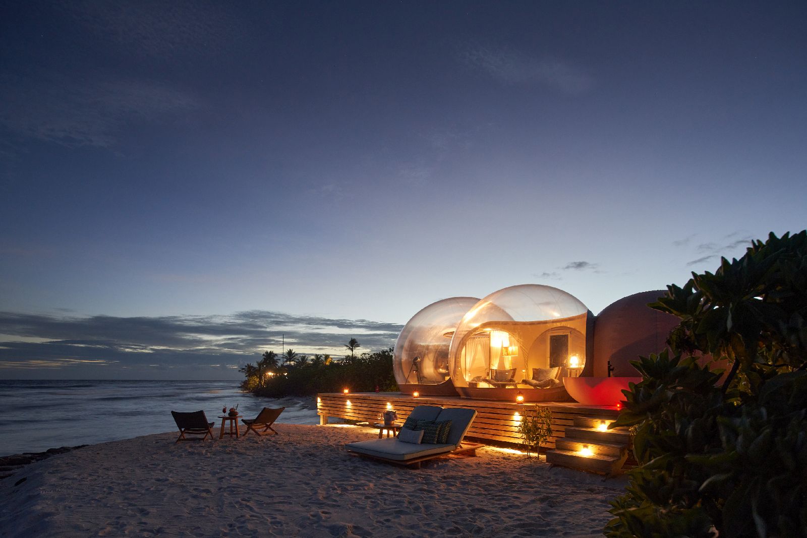 The private beach bubble at Finolhu Maldives at night