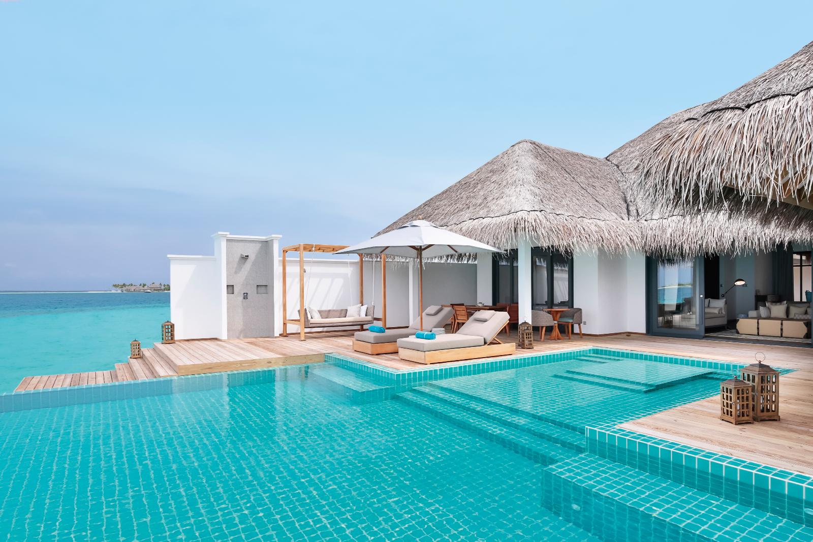 The swimming pool and facade of an ocean pool villa of Finolhu, Maldives