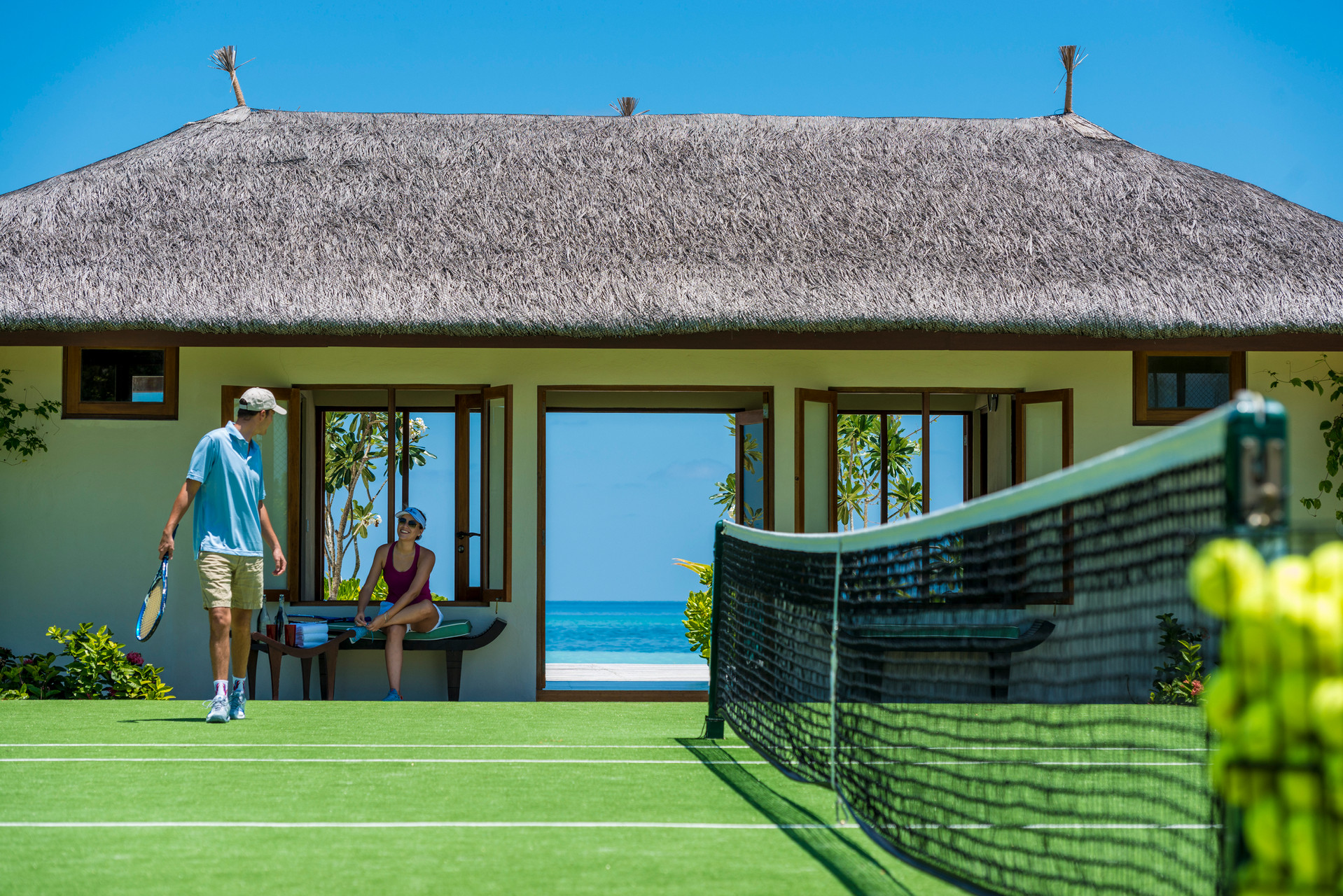 Playing tennis at Four Seasons Kuda Huraa