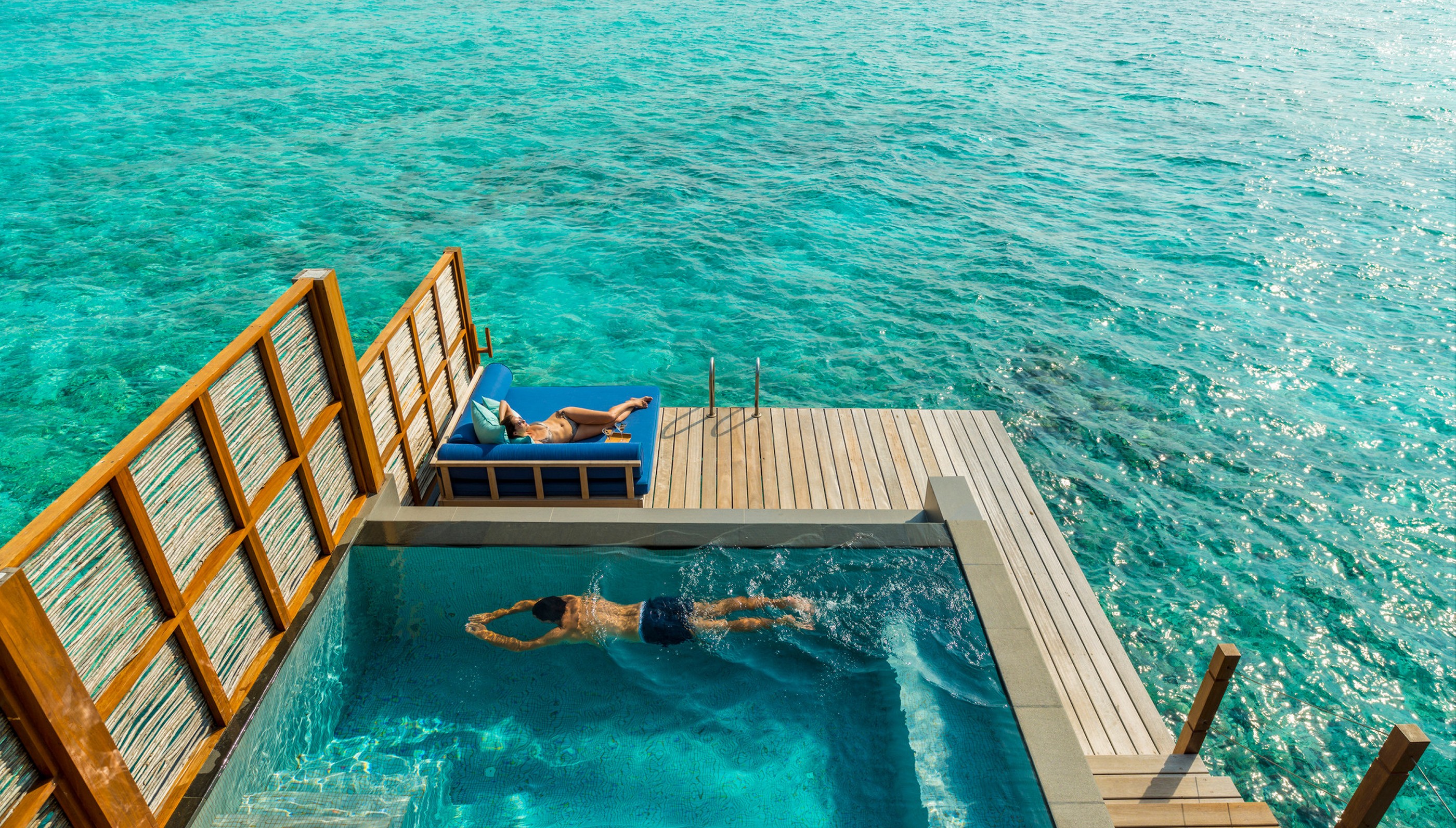 An overwater villa's private swimming pool at Four Seasons Landaa Giraavaru, Maldives
