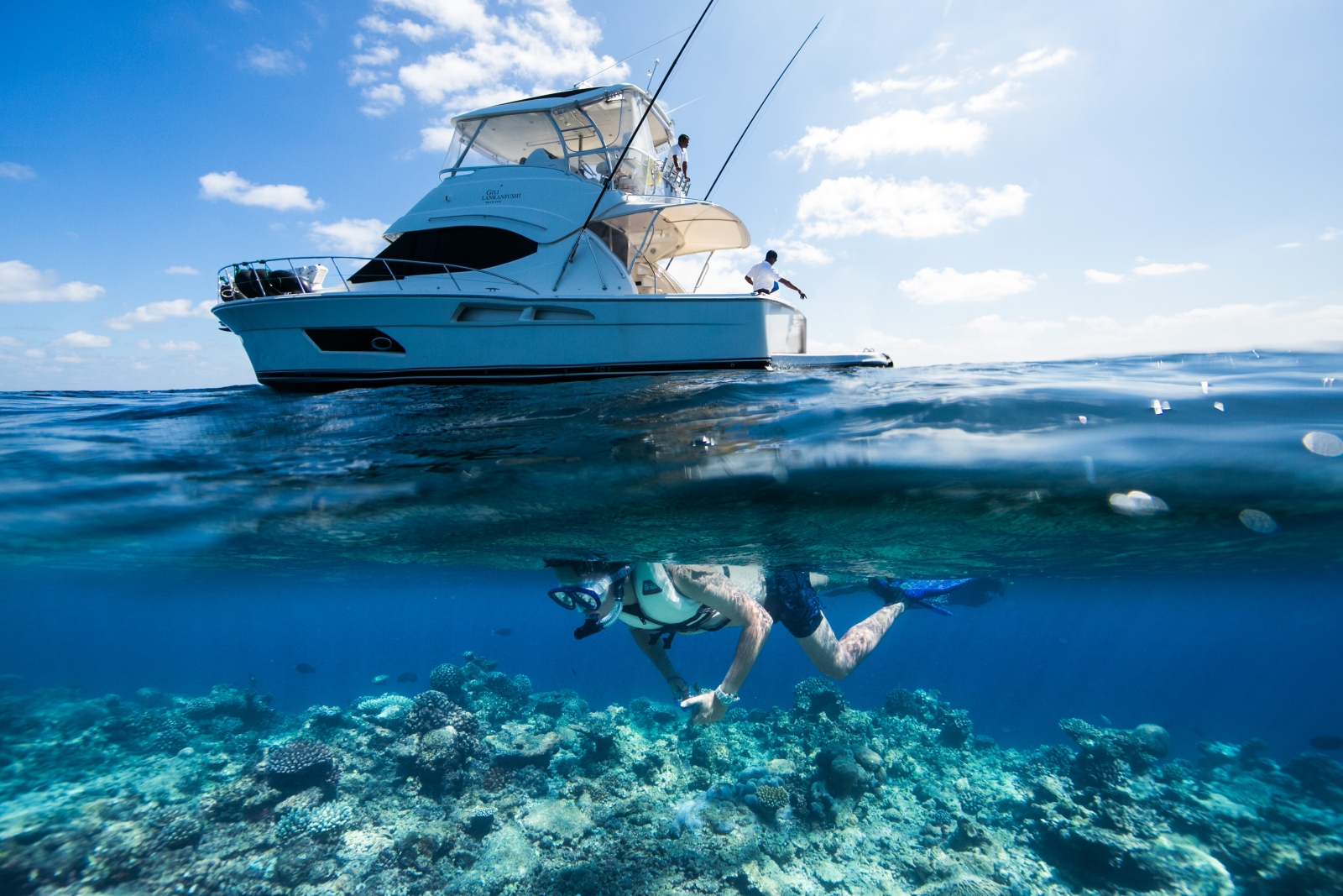 Guest on a private snorkel trip at luxury resort Gili Lankanfushi in the Maldives