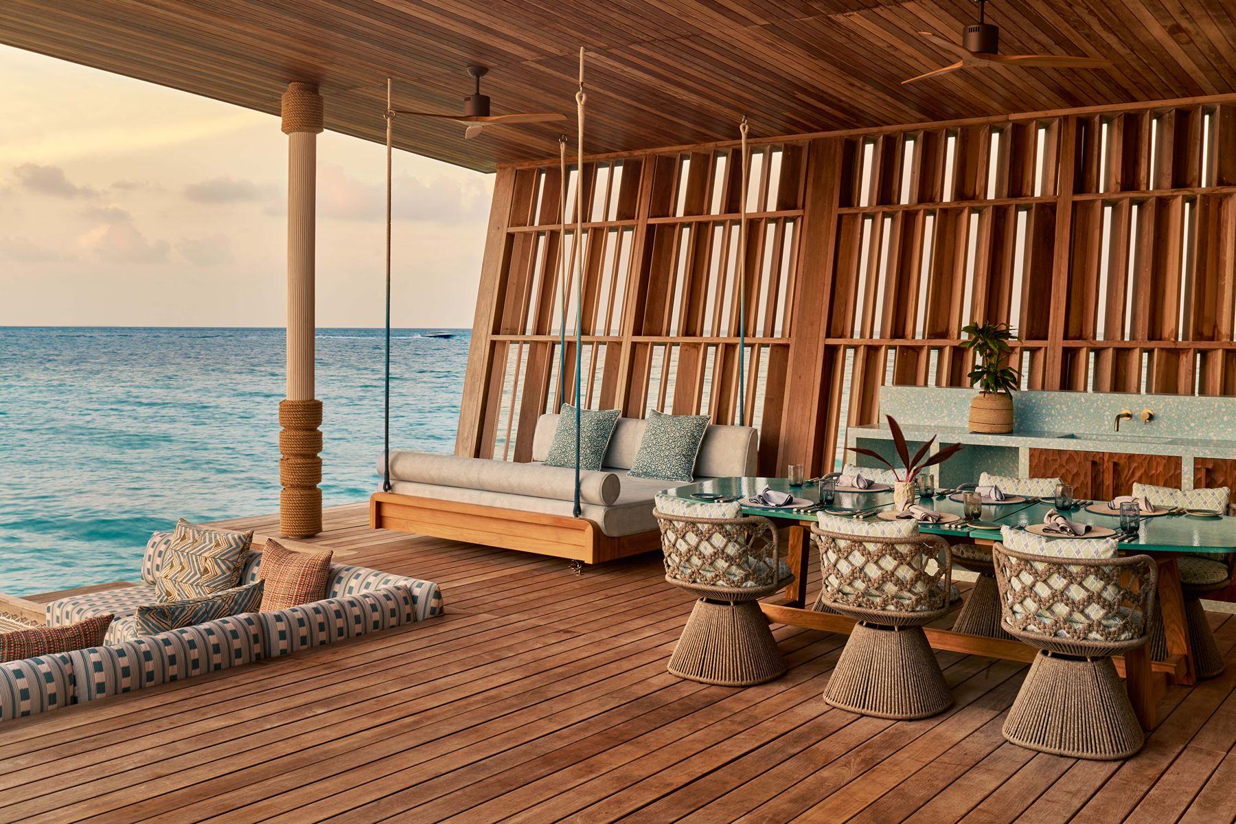 Overwater villa living area at .HERE Maldives.