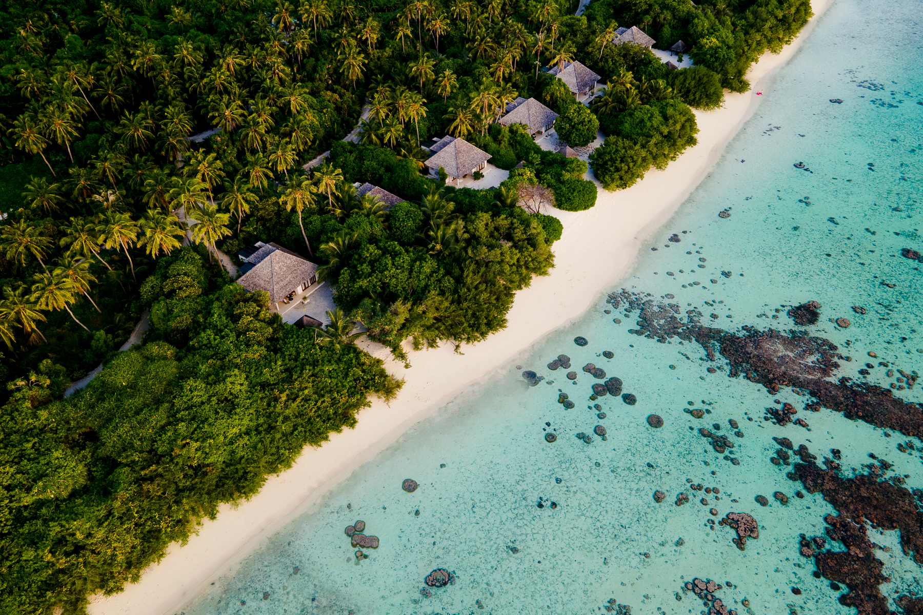 Aerial view of Beachfront villas at the Hideaway Beach Resort & Spa in the Maldives