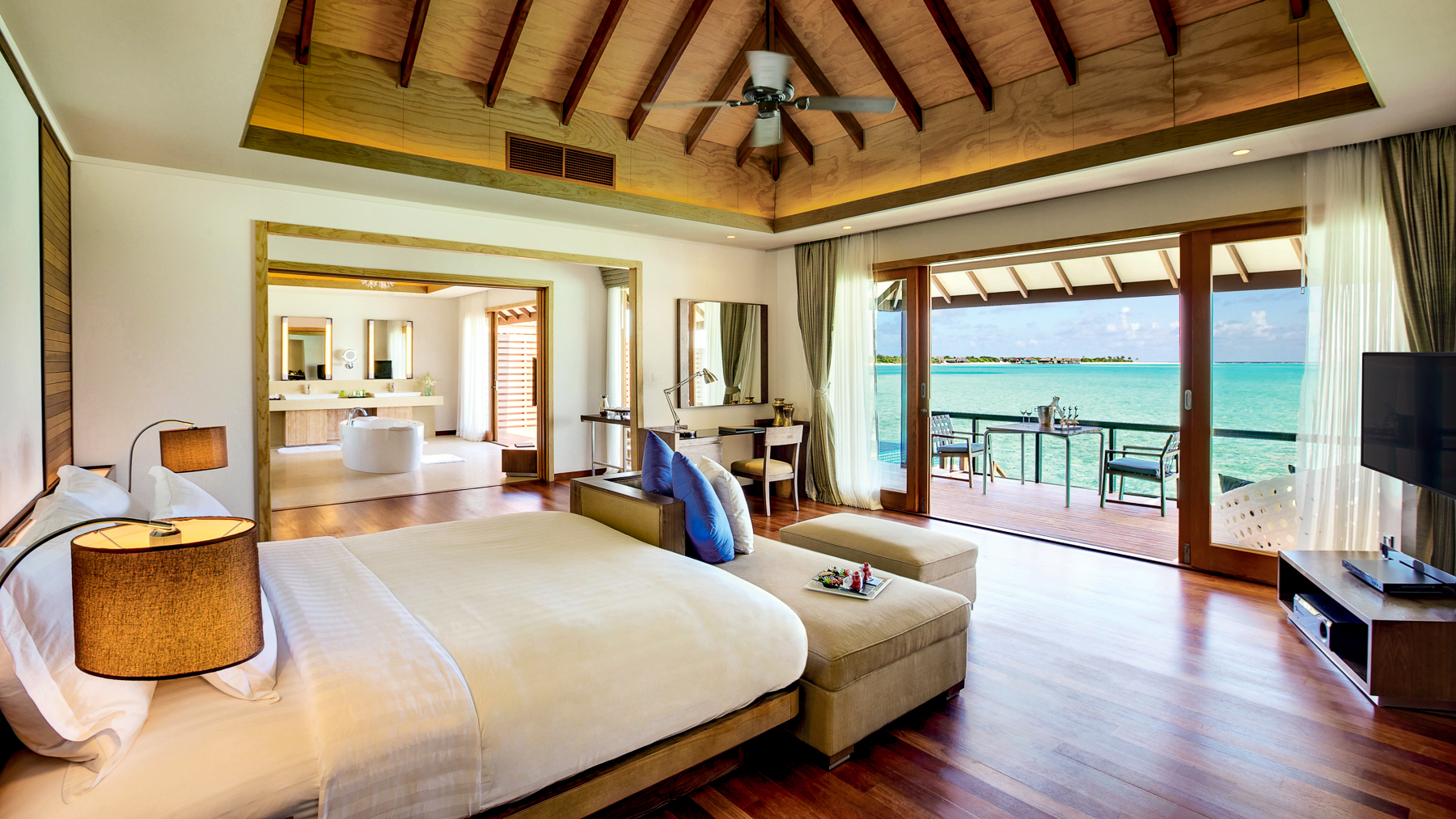 Bedroom in a Deluxe Overwater Villa at the Hideaway Beach Resort & Spa in the Maldives