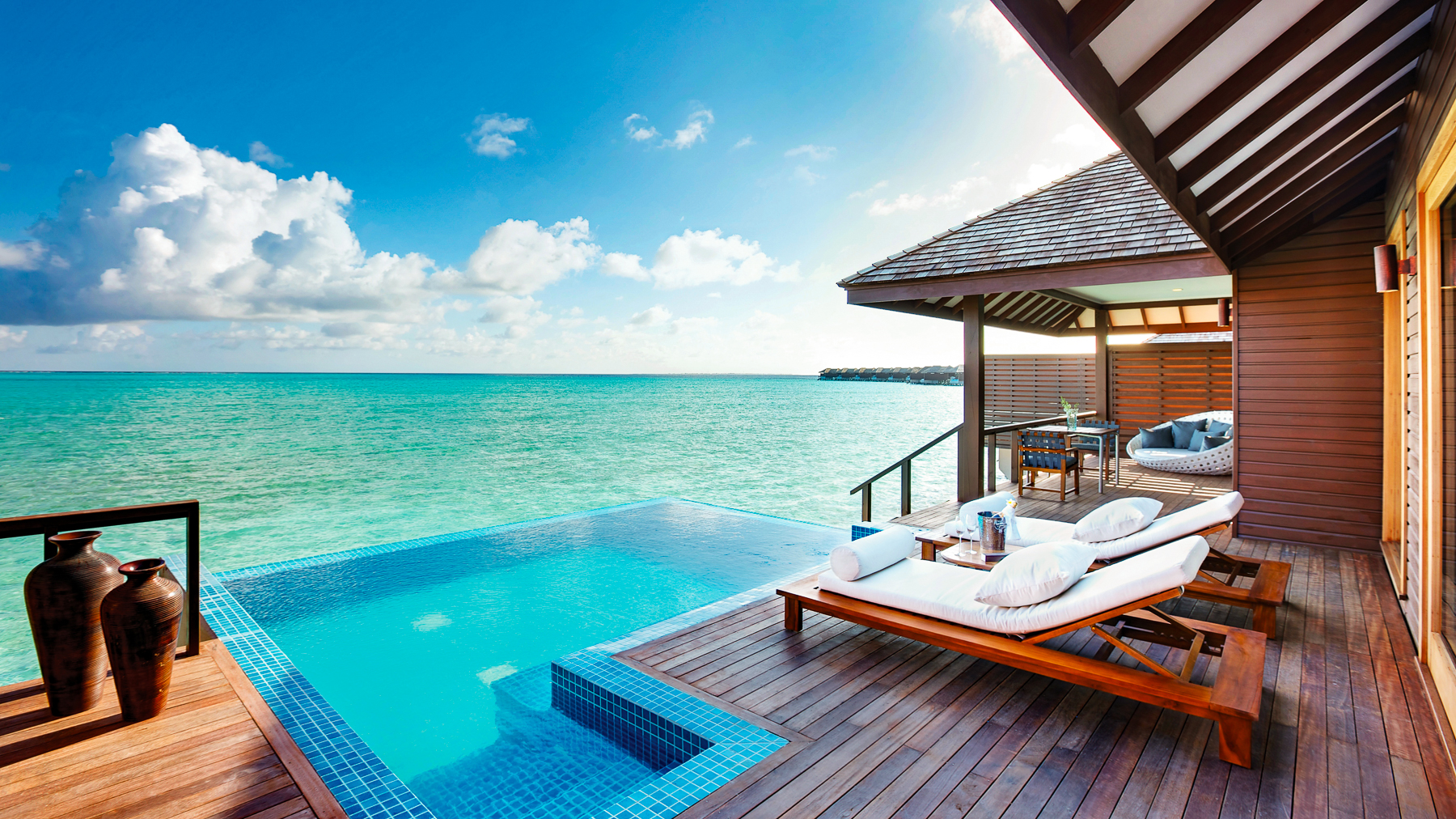 Swimming pool overlooking the ocean in a  Deluxe Water Villa at the Hideaway Beach Resort & Spa in the Maldives