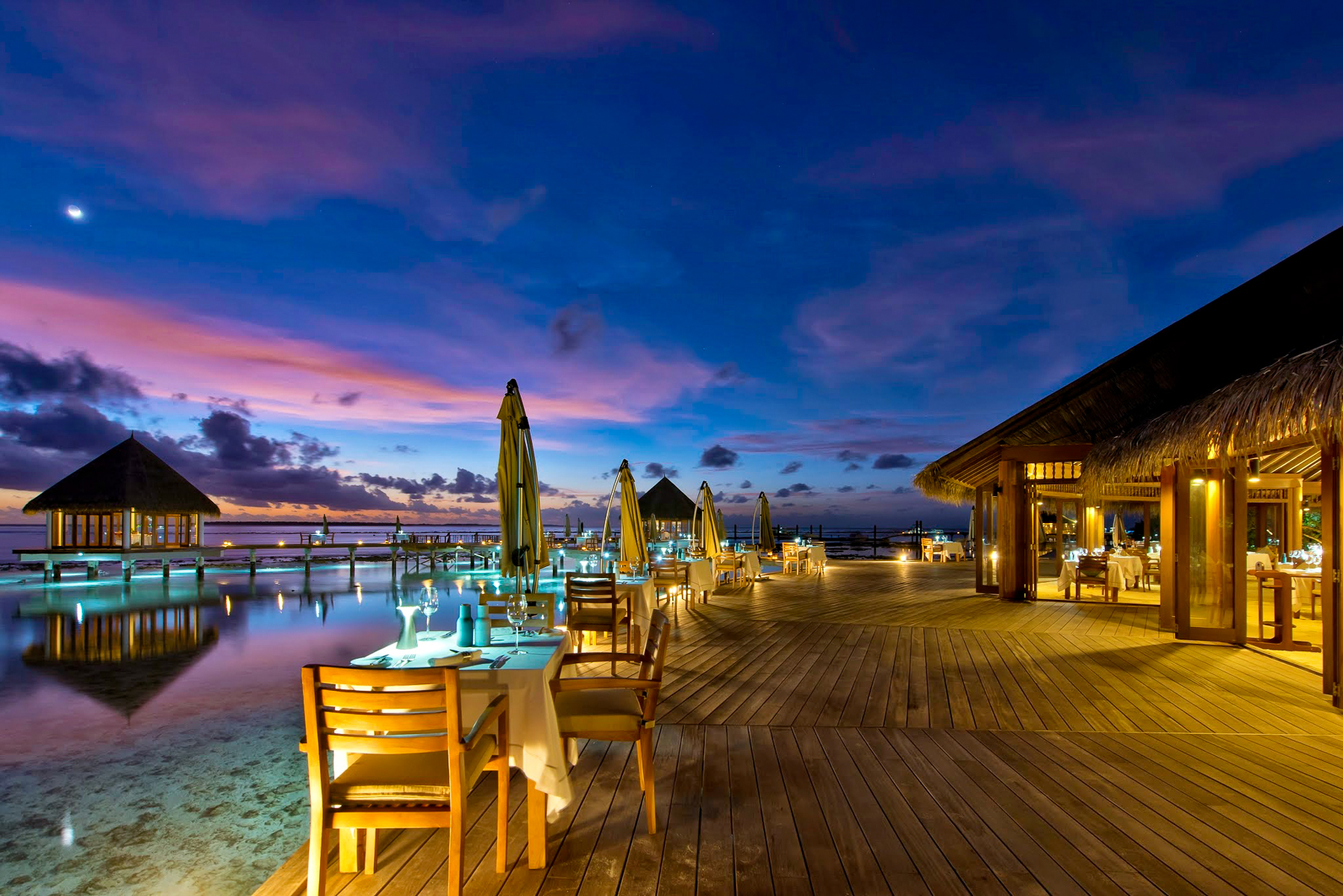 Matheefaru restaurant terrace and dining tables at the Hideaway Beach Resort & Spa in the Maldives