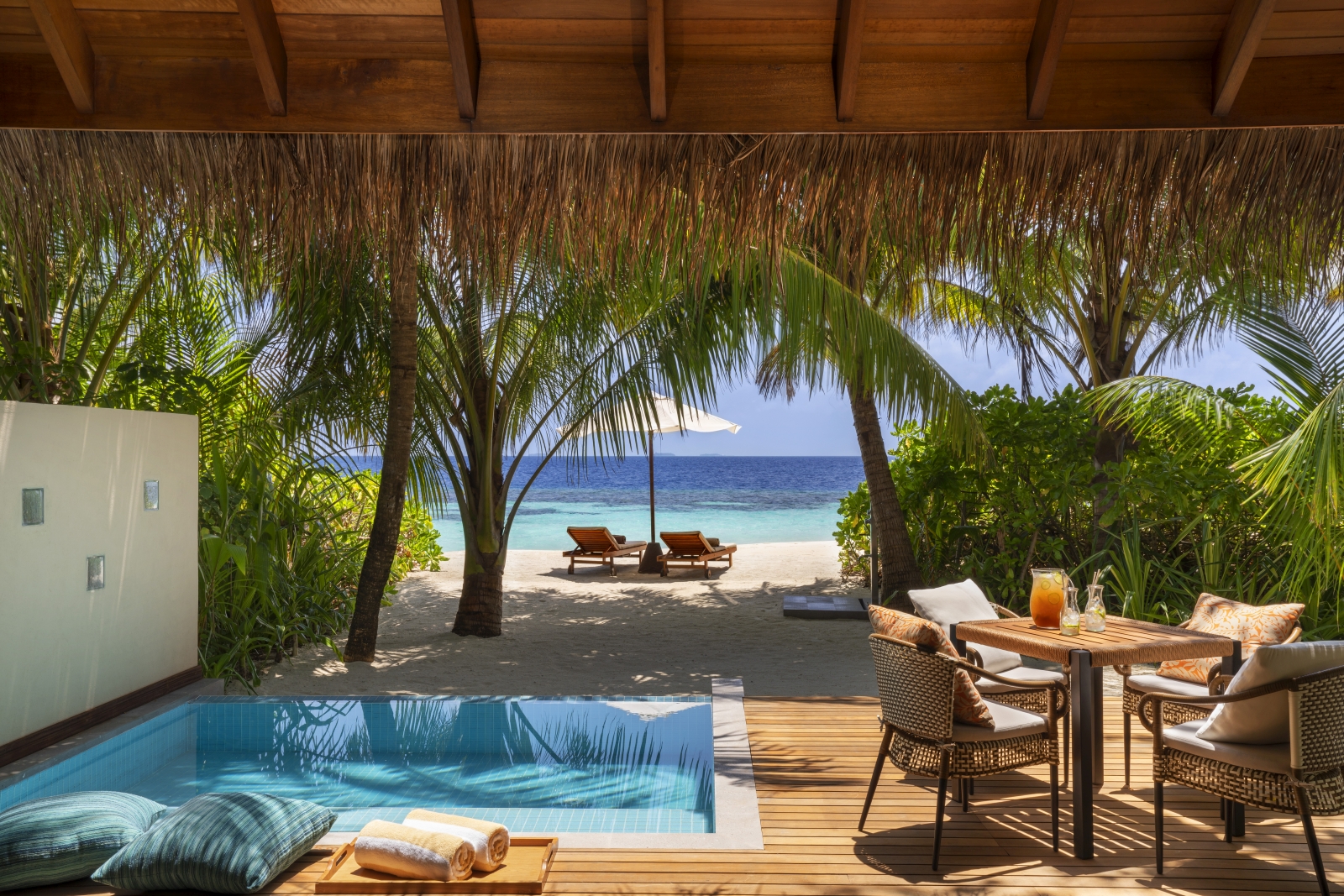 Private pool and terrace of a Deluxe Beach Bungalow at luxury resort Huvafen Fushi in the Maldives