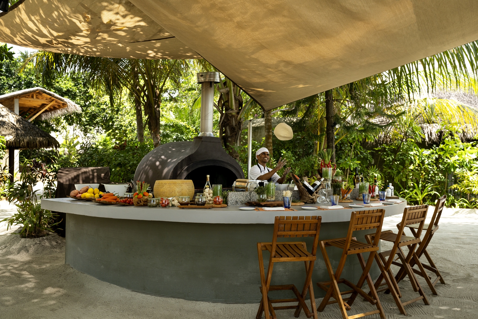 Pizza oven and bar of Forno restaurant at luxury resort Huvafen Fushi in the Maldives
