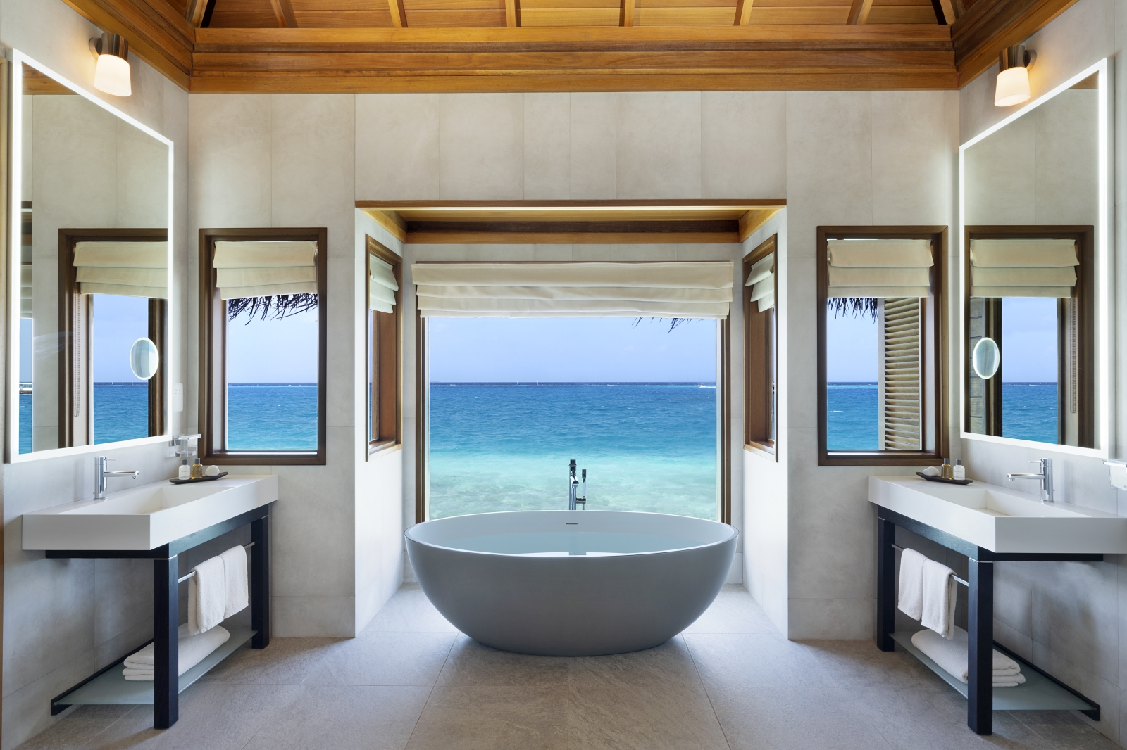 Bathroom with freestanding bath in a Lagoon Bungalow at luxury resort Huvafen Fushi in the Maldives