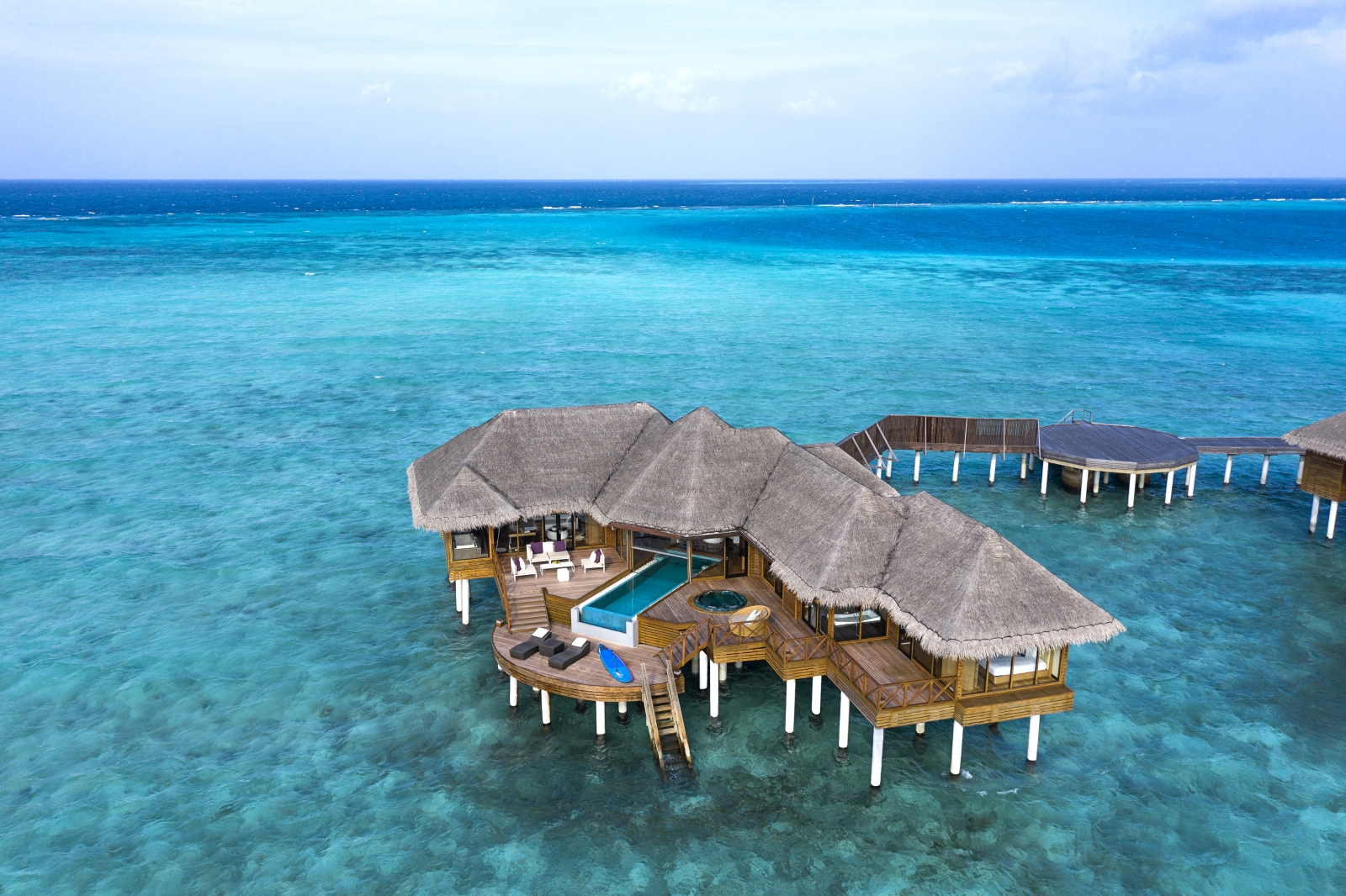 Aerial view of an Ocean Pavilion at luxury resort Huvafen Fushi in the Maldives