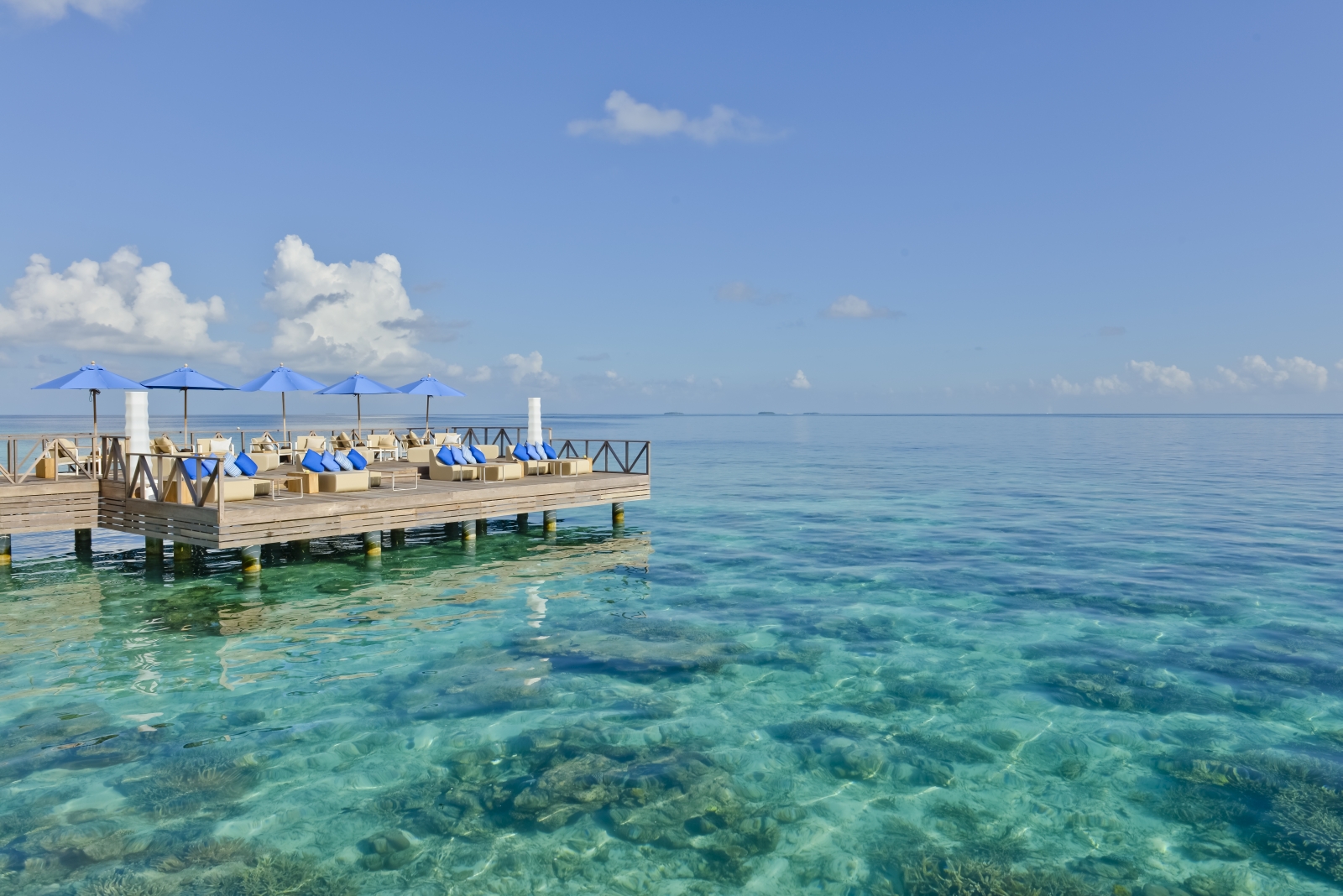 Dining on the deck of Raw Restaurant at luxury resort Huvafen Fushi in the Maldives