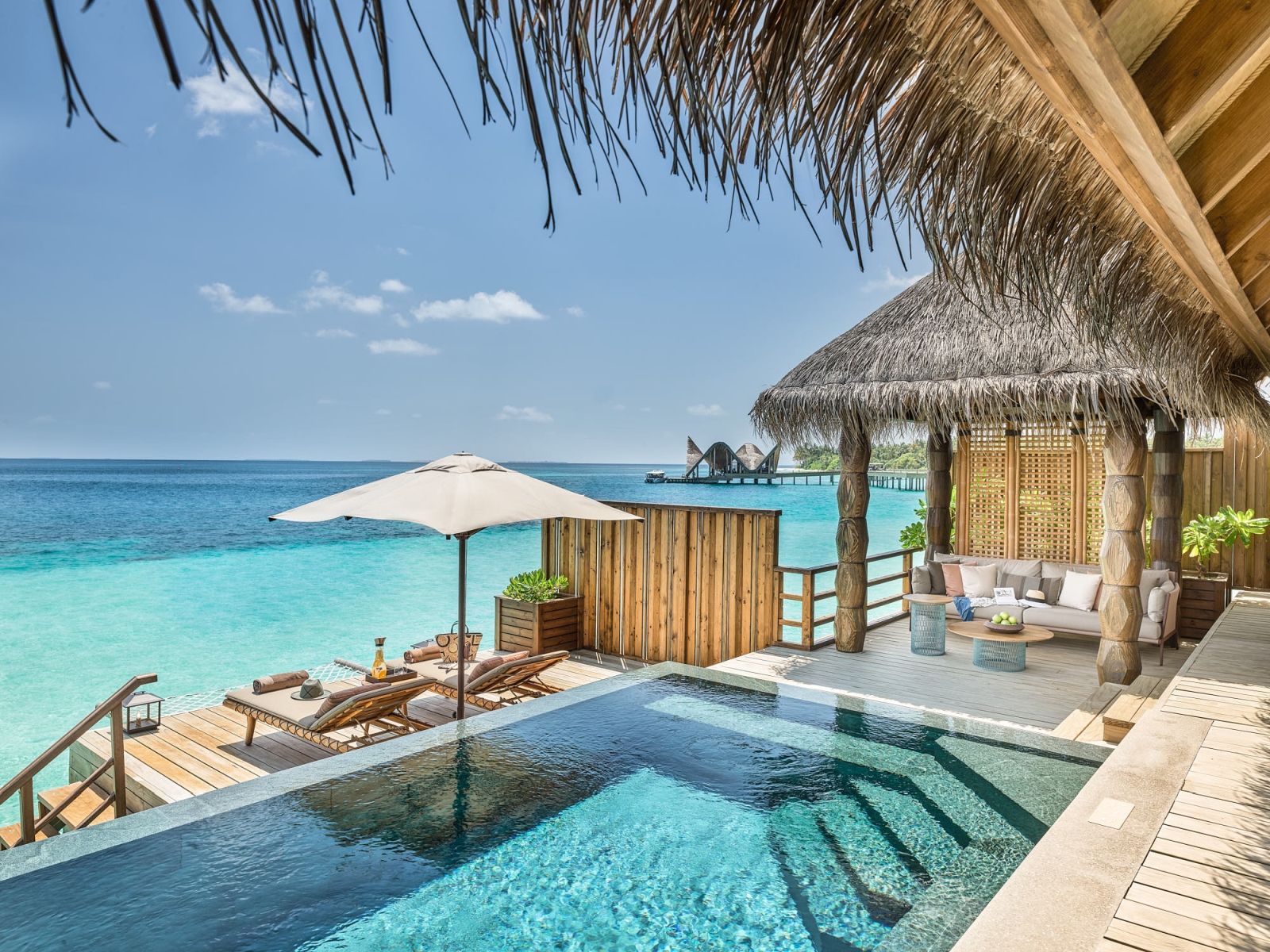 Terrace of a Water Villa with private pool at luxury resort Joali in the Maldives