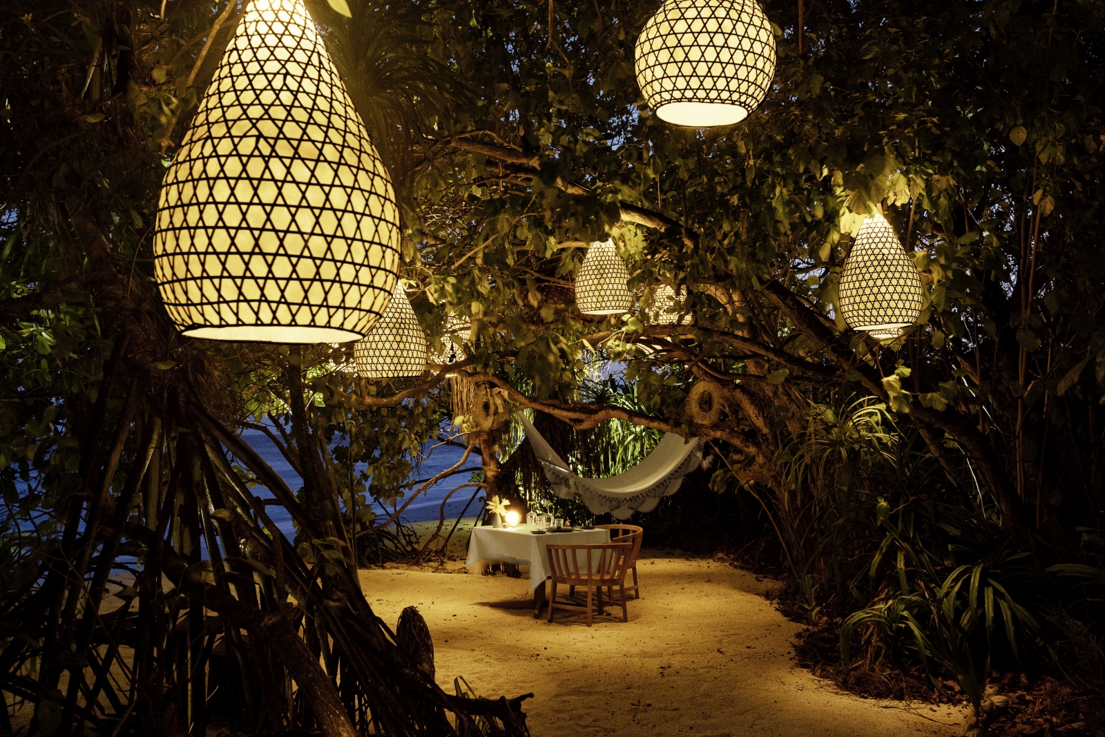 Destination dining under the trees at luxury resort Kudadoo Private Island in the Maldives