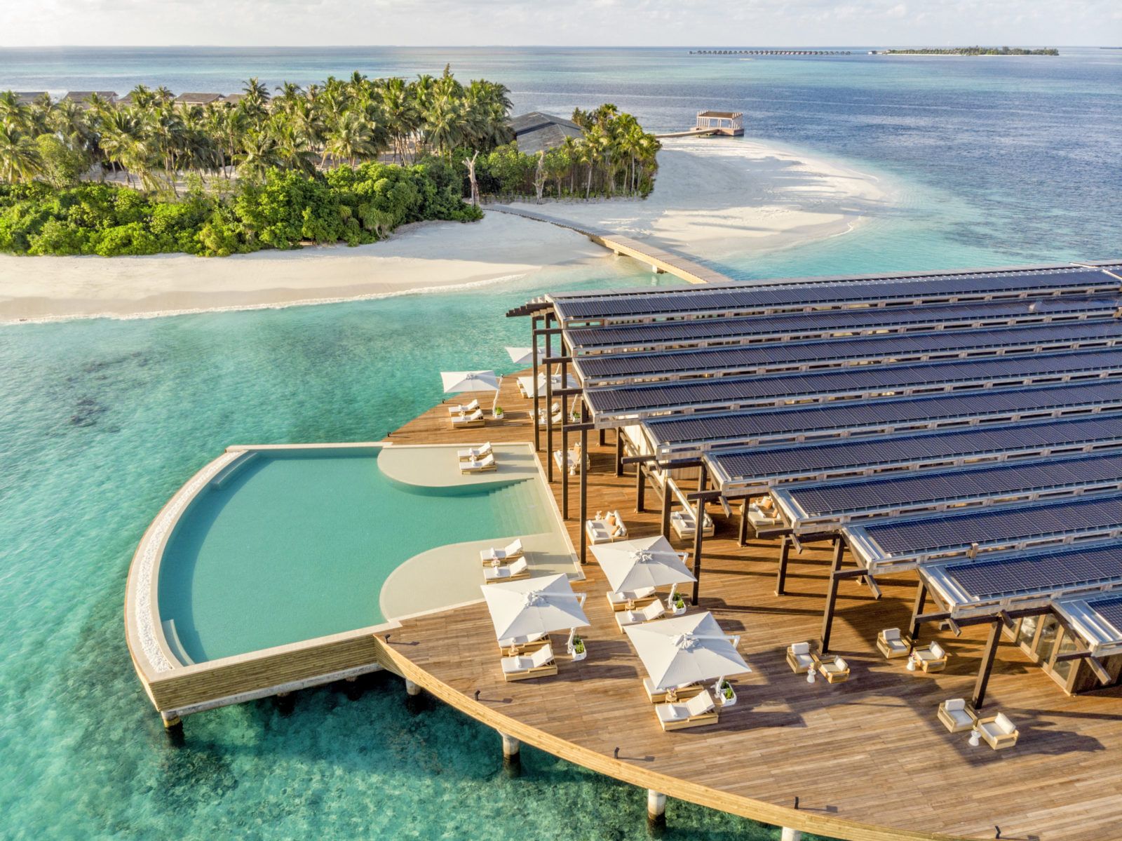 Aerial view of the infinity pool,  bar and restaurant at Kudadoo Maldives Private Island
