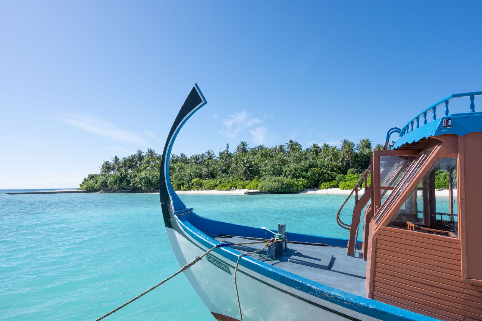A boat on the waters surrounding Mukundu Island Resort in the Maldives