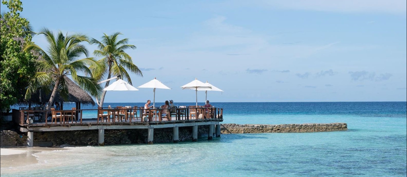 Ocean deck with seating area at Mukunudu Island resort in the Maldives
