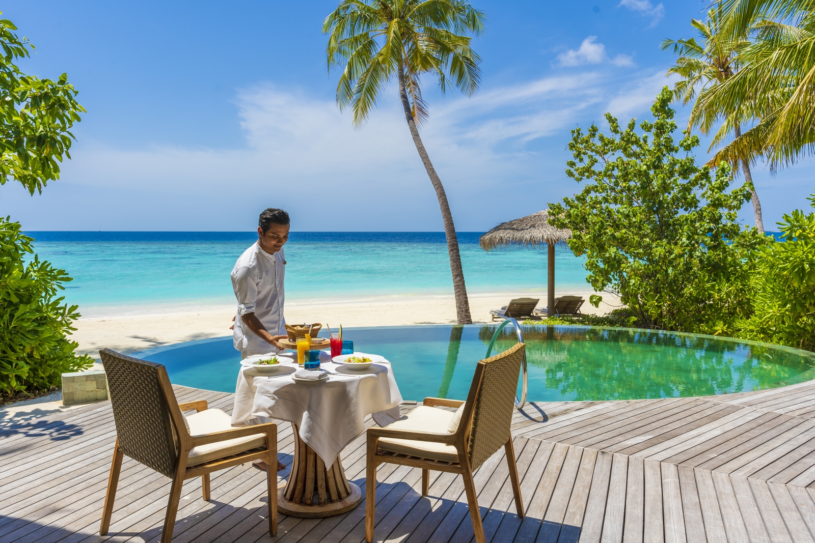 Breakfast served by a private pool luxury resort Milaidhoo in the Maldives