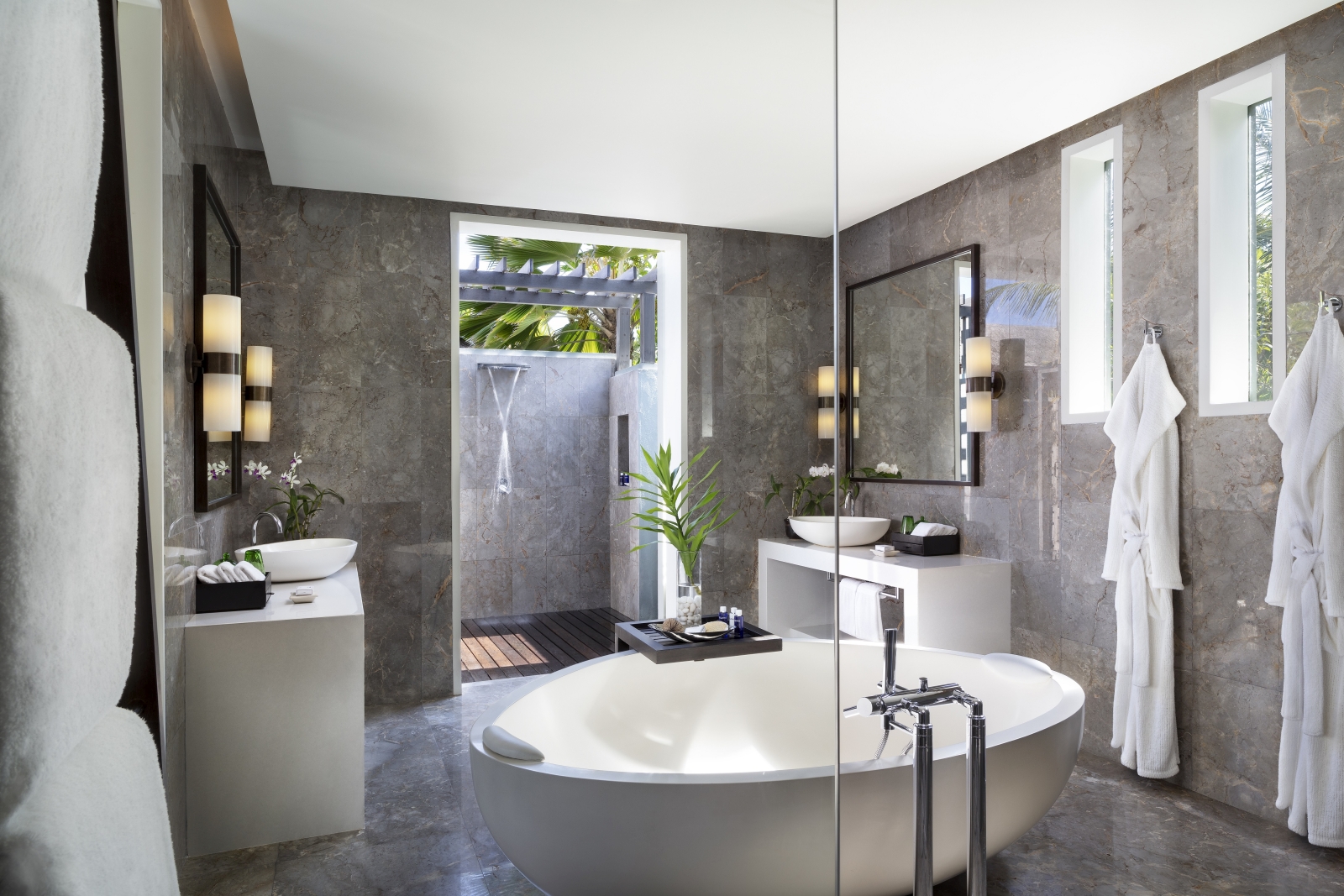 Bathroom with freestanding bathtub in a residence at luxury resort Naladhu in the Maldives