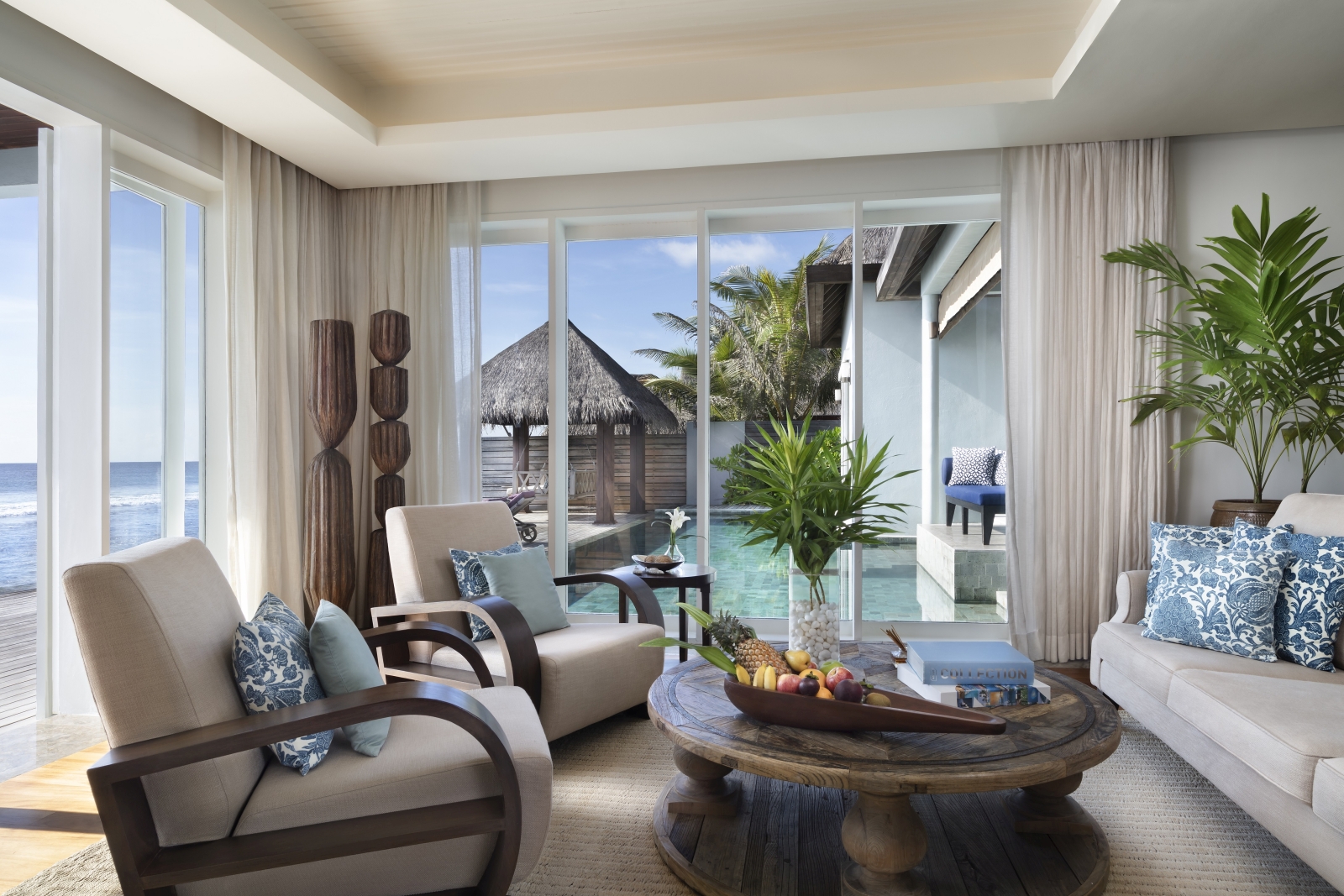 Living Room with comfortable seating in a residence at luxury resort Naladhu in the Maldives