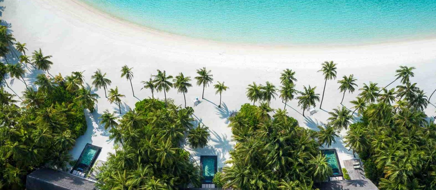 Aerial view of beach villas white sand beach at OneAndOnly Reethi Rah Maldives