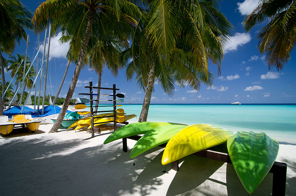 Kayaks and boards on the beach of Reethi Rah, Maldives